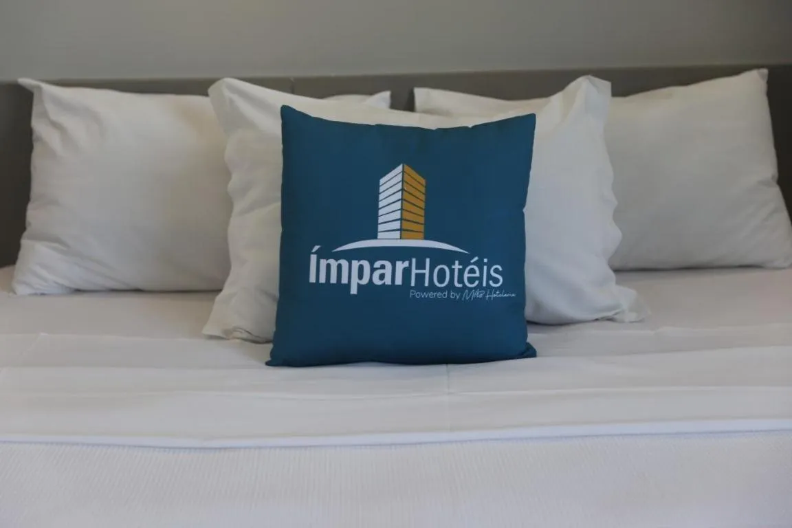 Bed in Ímpar Suítes Expominas