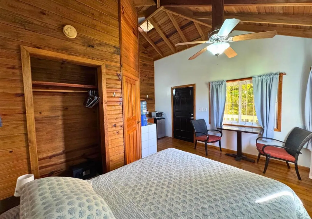 Kitchen or kitchenette, Bed in Guava Grove Resort & Villas
