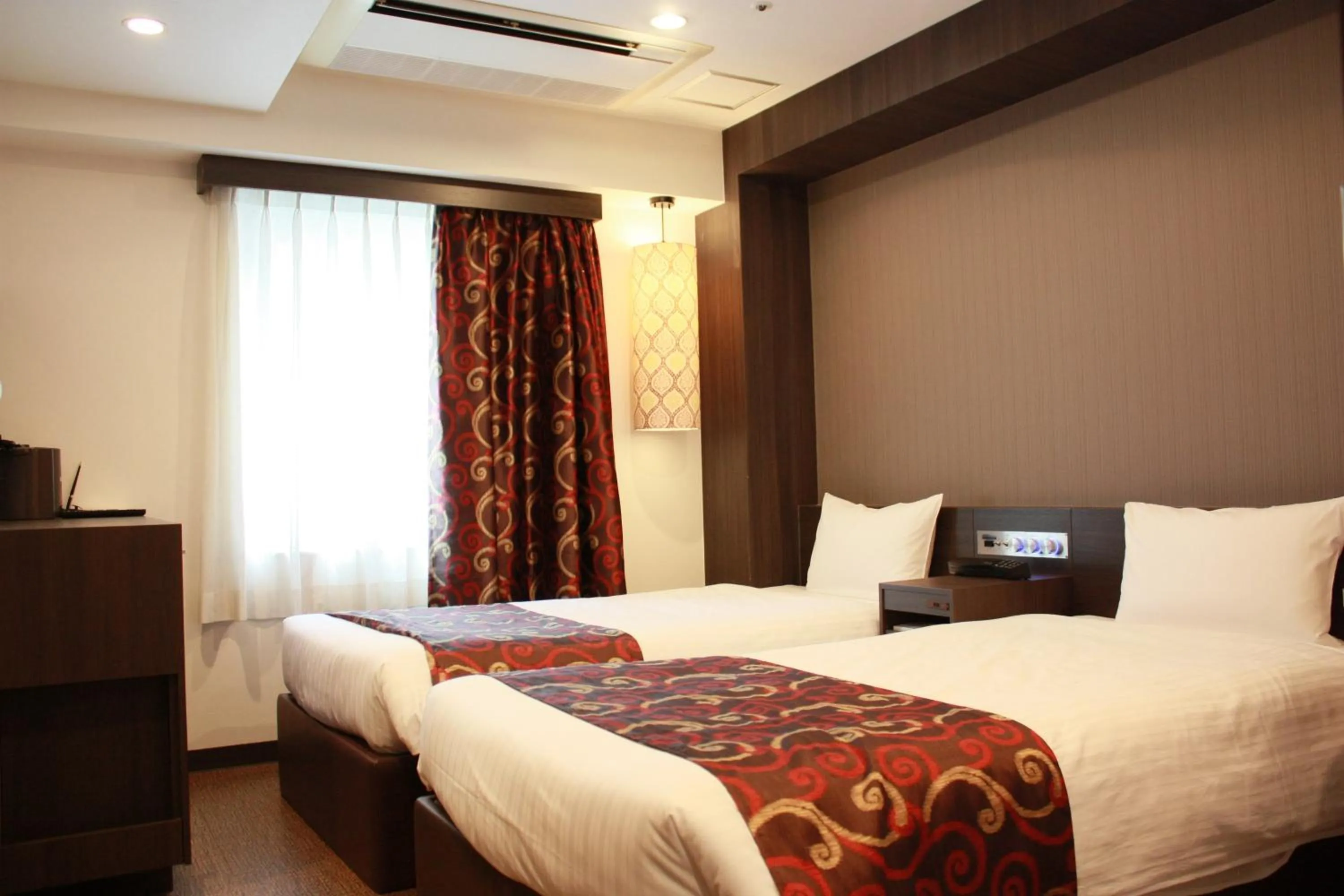 Bed in Hotel LiVEMAX Umeda Central