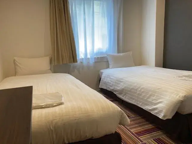 Bed in Hotel LiVEMAX Umeda Central Bed in Hotel LiVEMAX Umeda Central