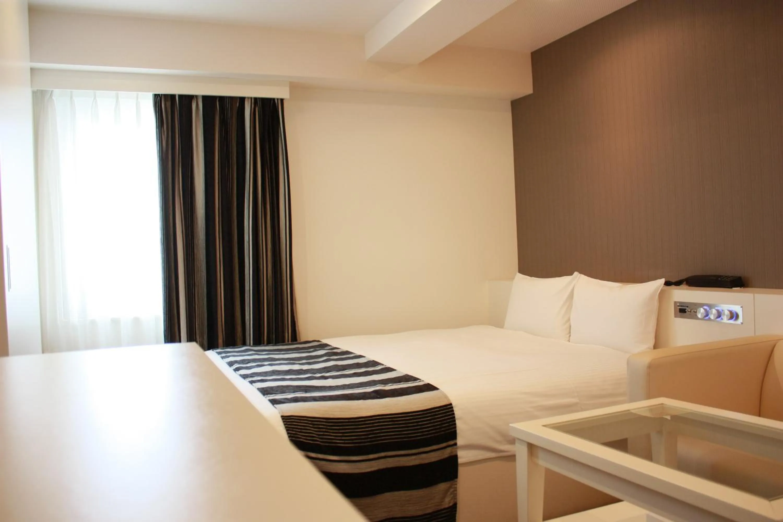 Bed in Hotel LiVEMAX Umeda Central