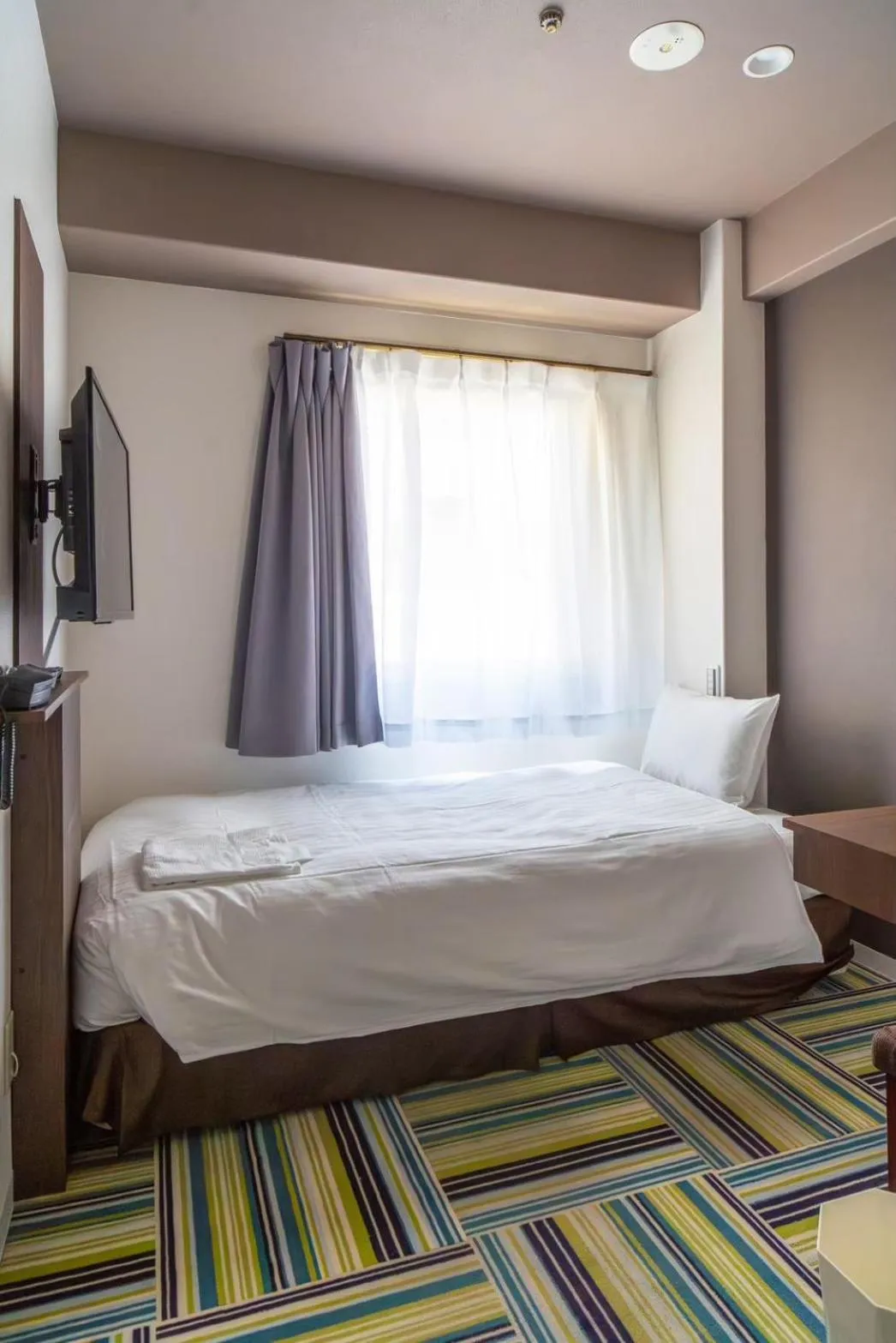 Bed in Hotel LiVEMAX Umeda Central