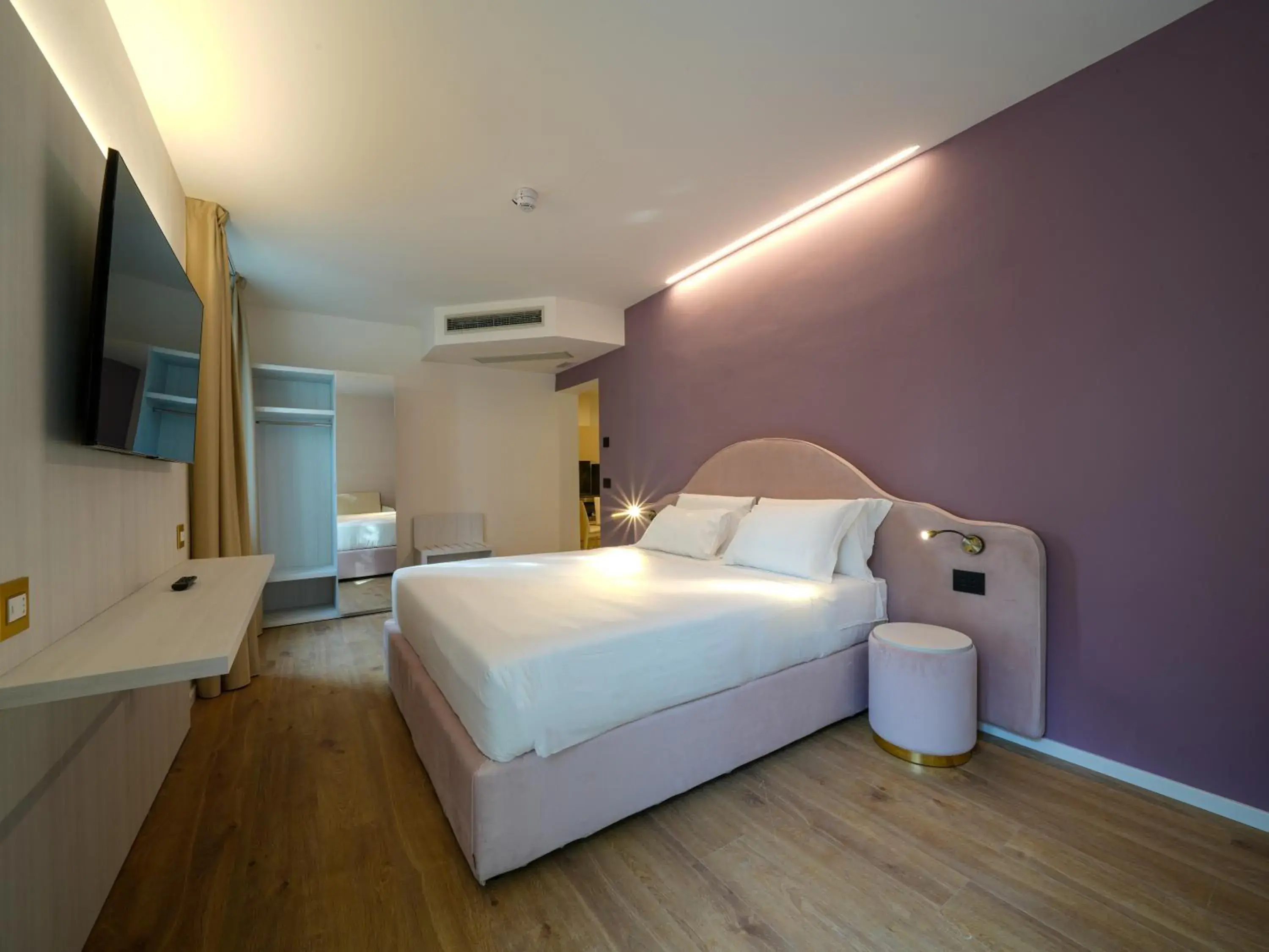 Photo of the whole room, Bed in Hotiday Castiglioncello Suite Photo of the whole room, Bed in Hotiday Castiglioncello Suite