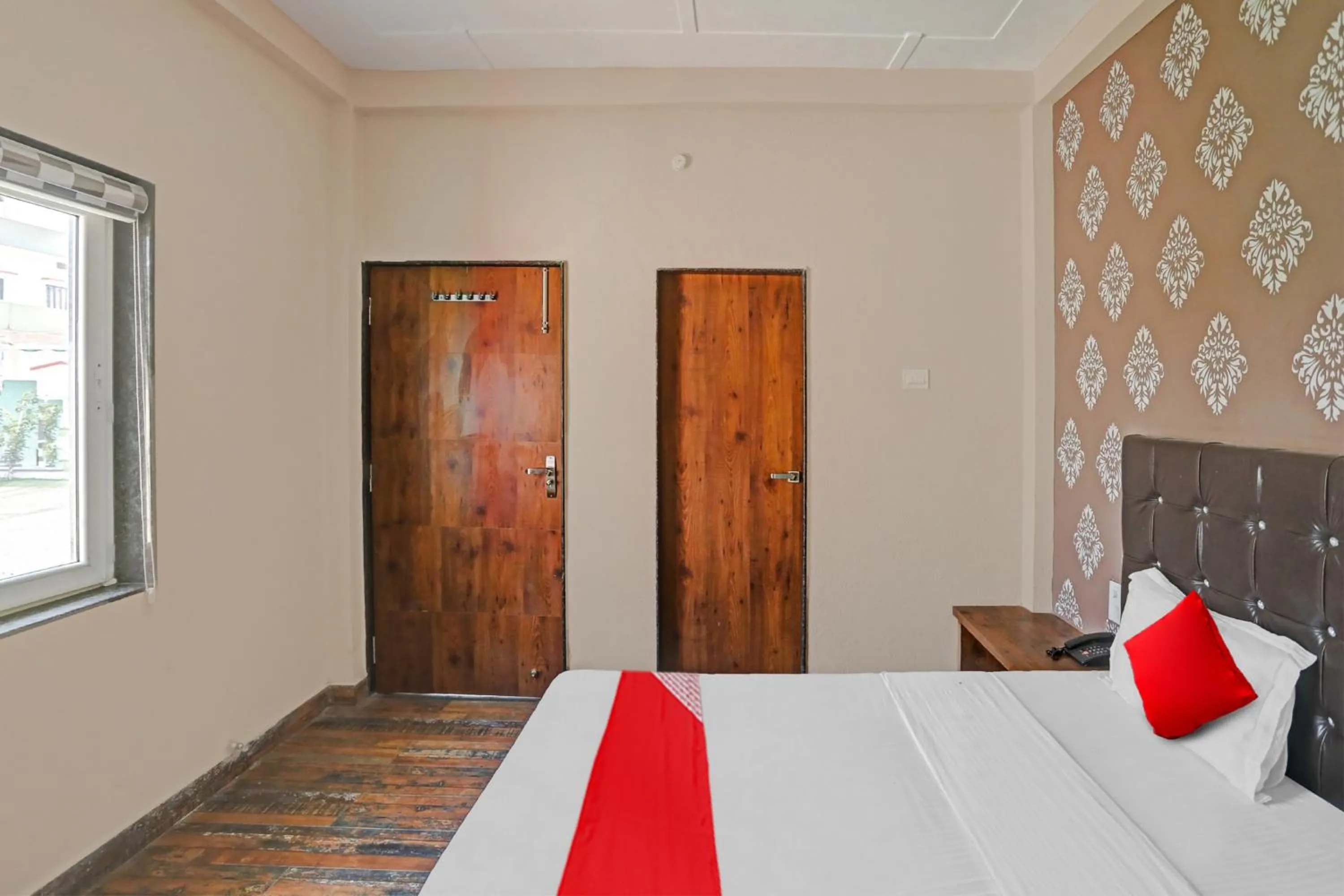 Bedroom in Hotel O MH Inn