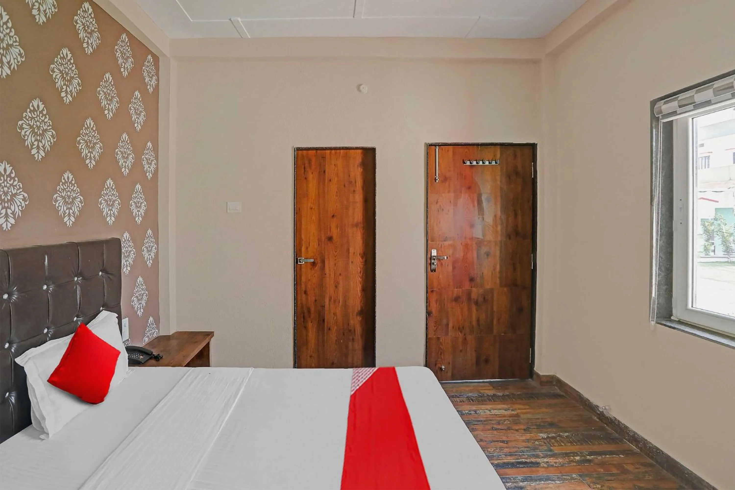 Bedroom in Hotel O MH Inn