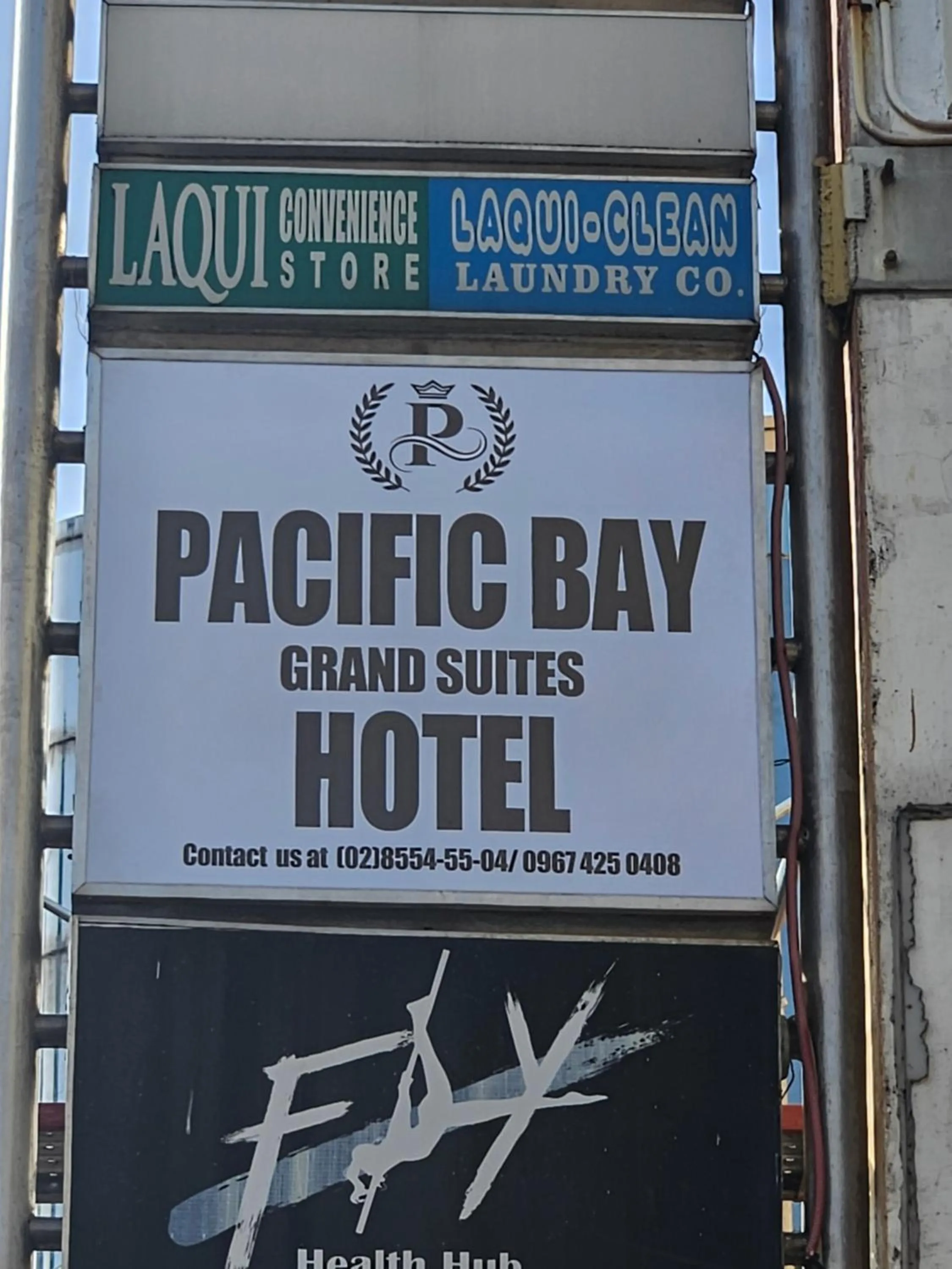 Property logo or sign in Pacific Bay Grand Suites