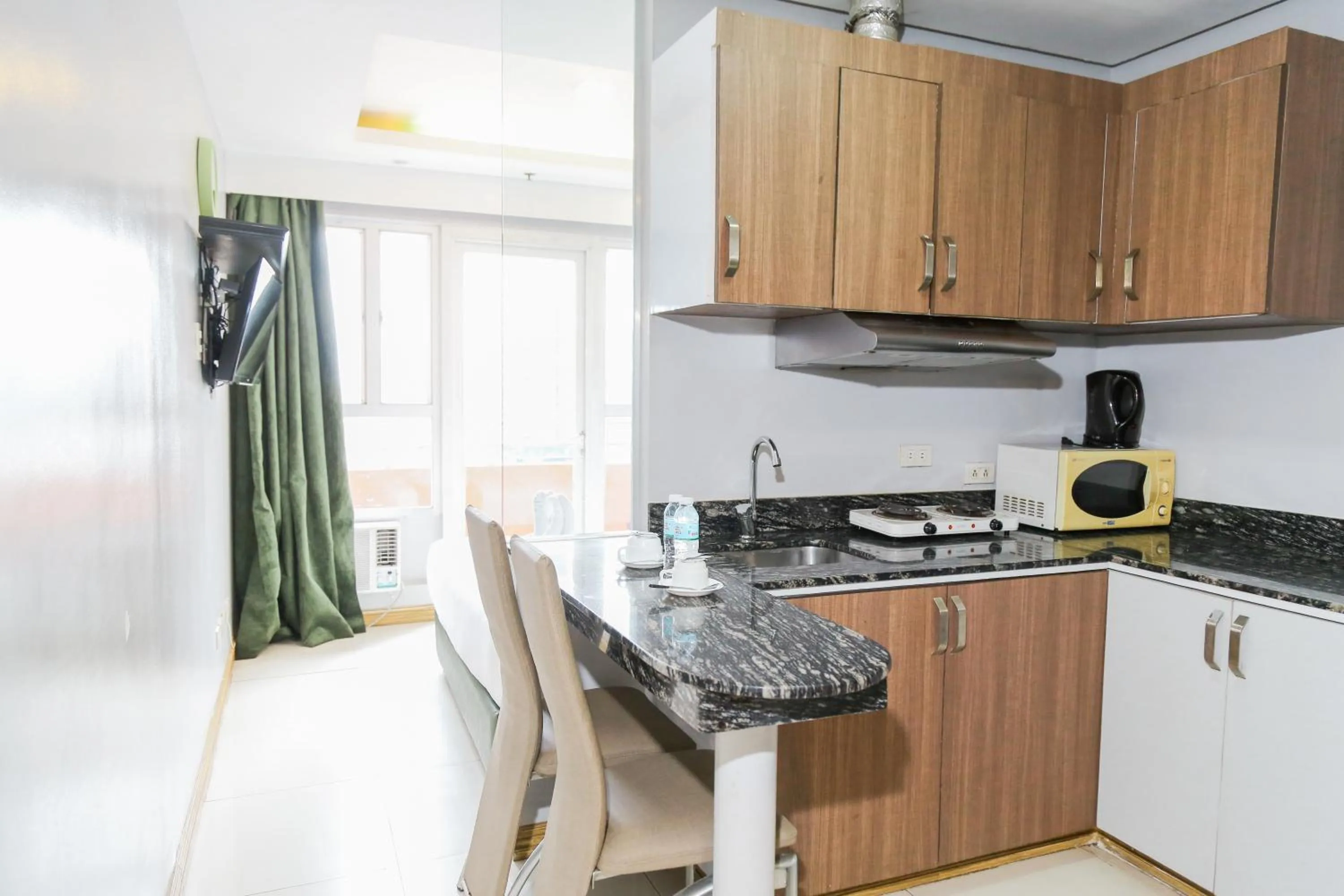 Kitchen or kitchenette in Pacific Bay Grand Suites