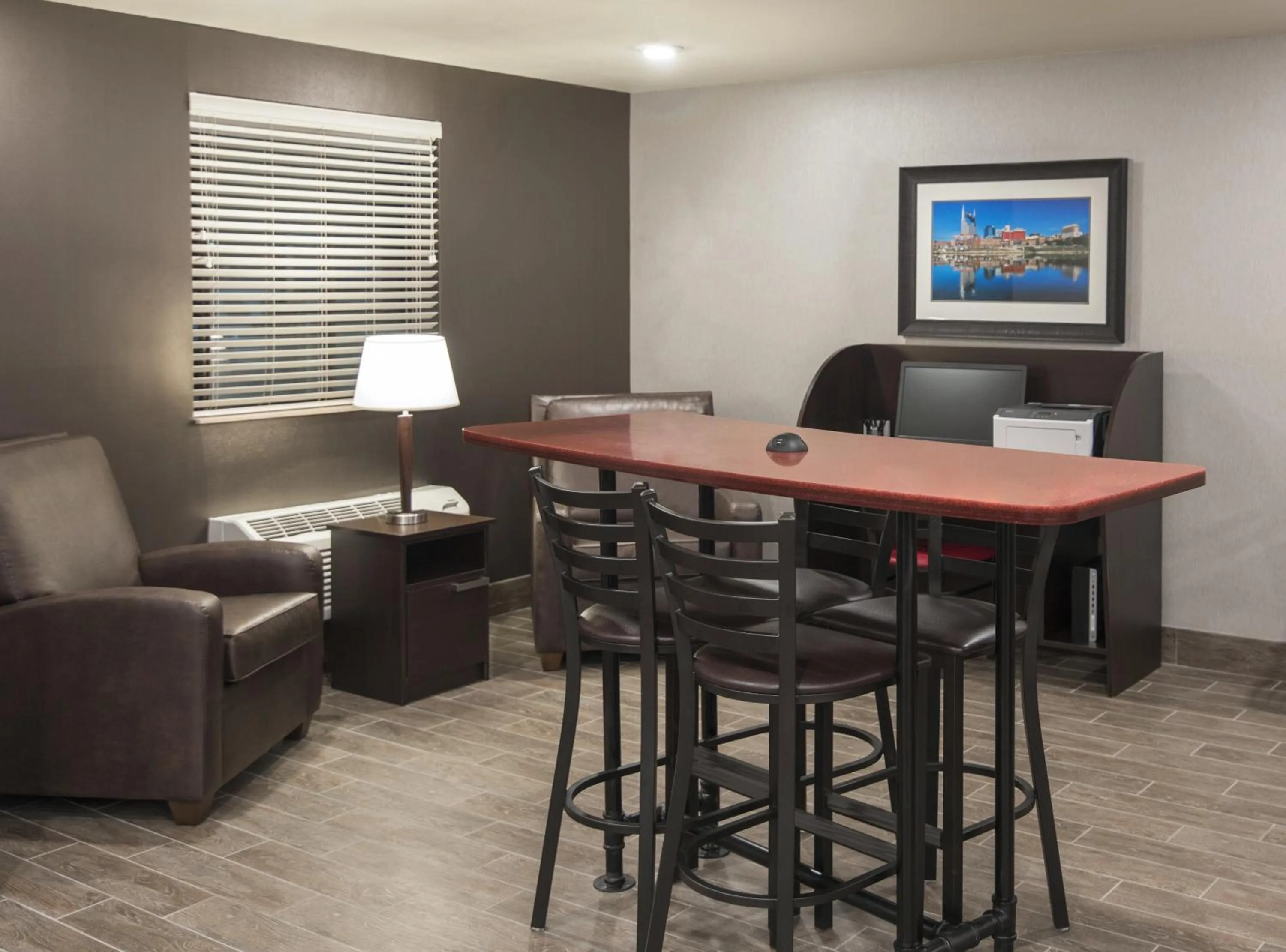 Communal lounge/ TV room in My Place Hotel-East Moline/Quad Cities, IL