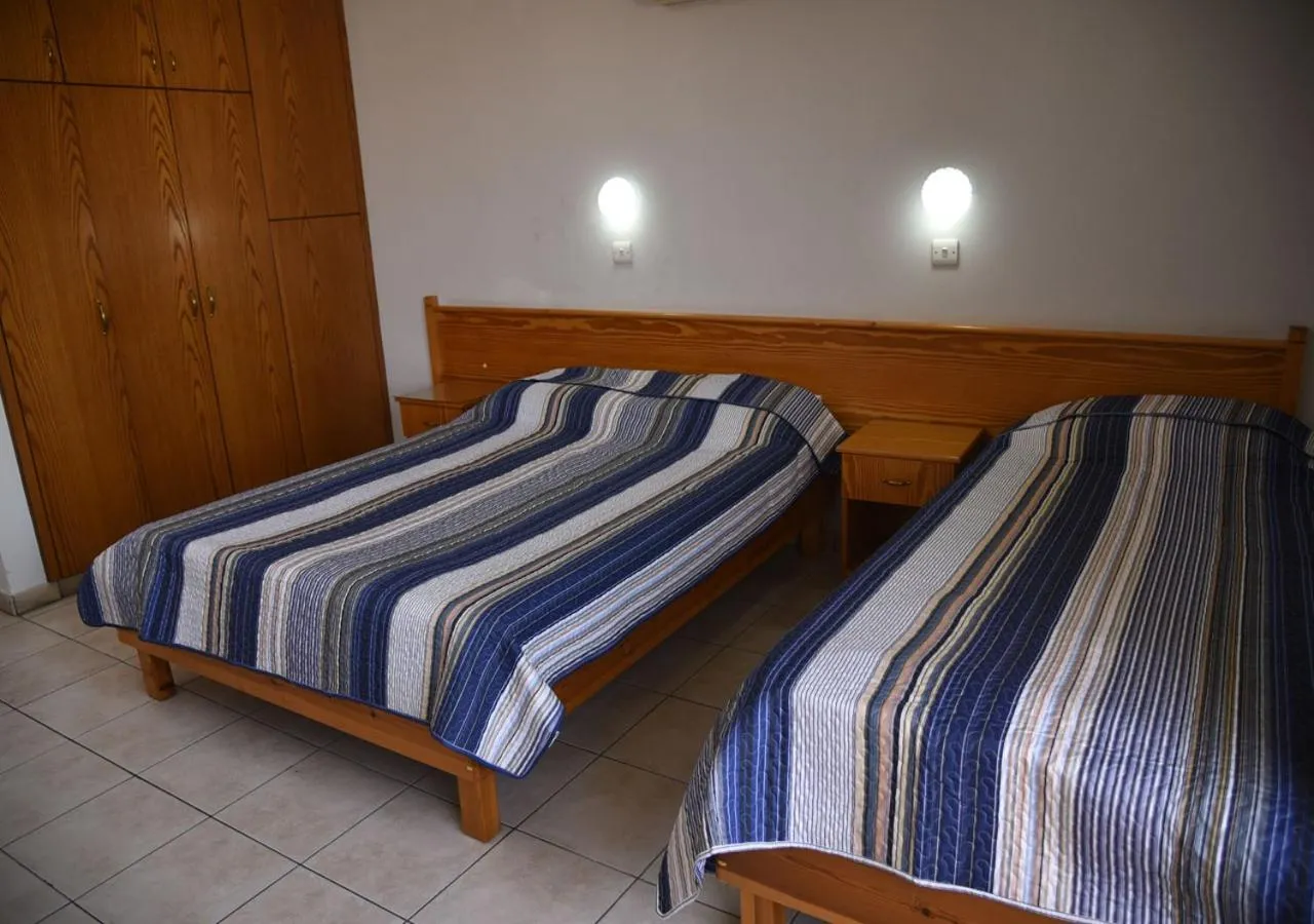 Bed in Elysso Apartments