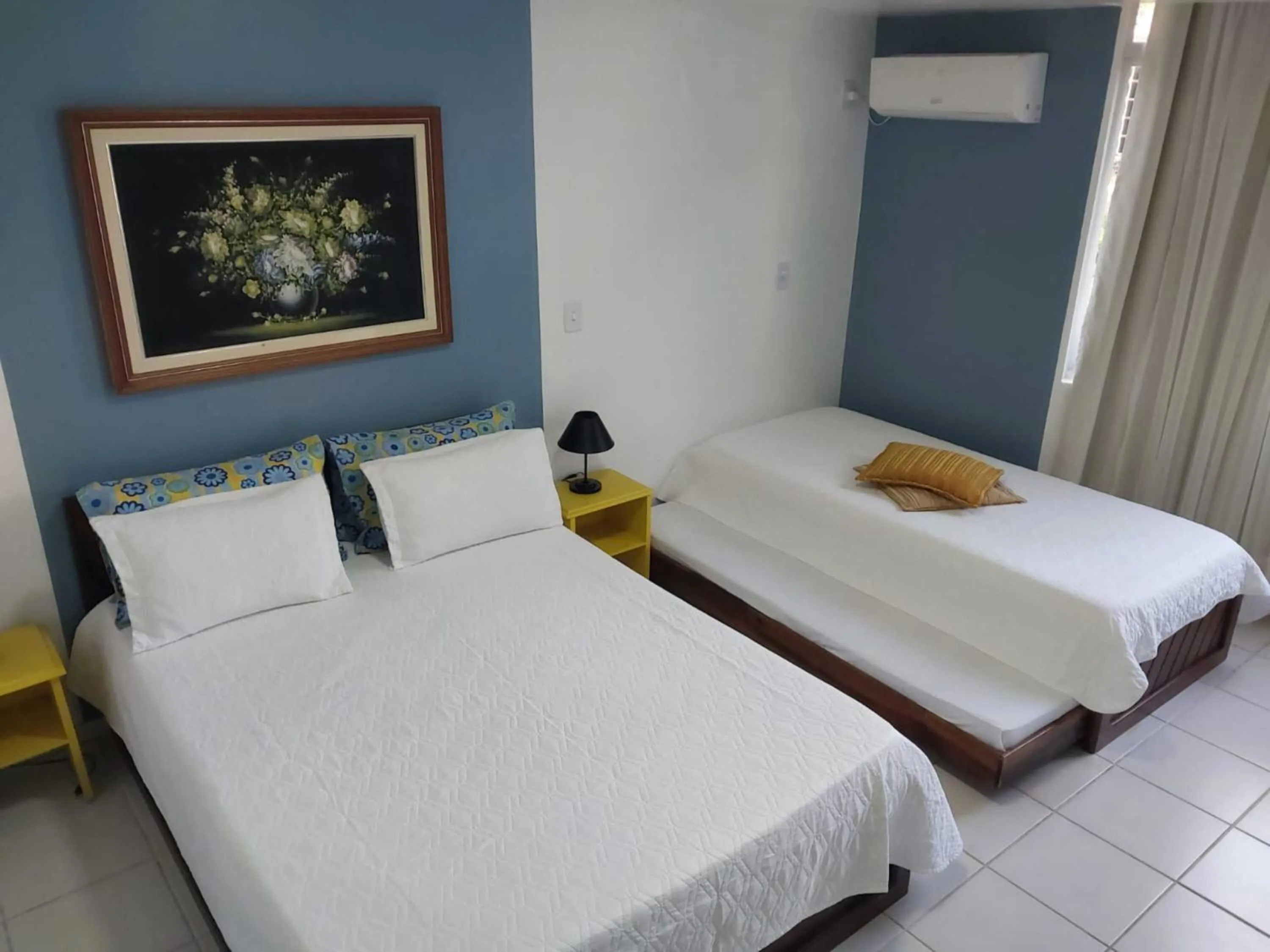 Bed in Flamboyant Hotel