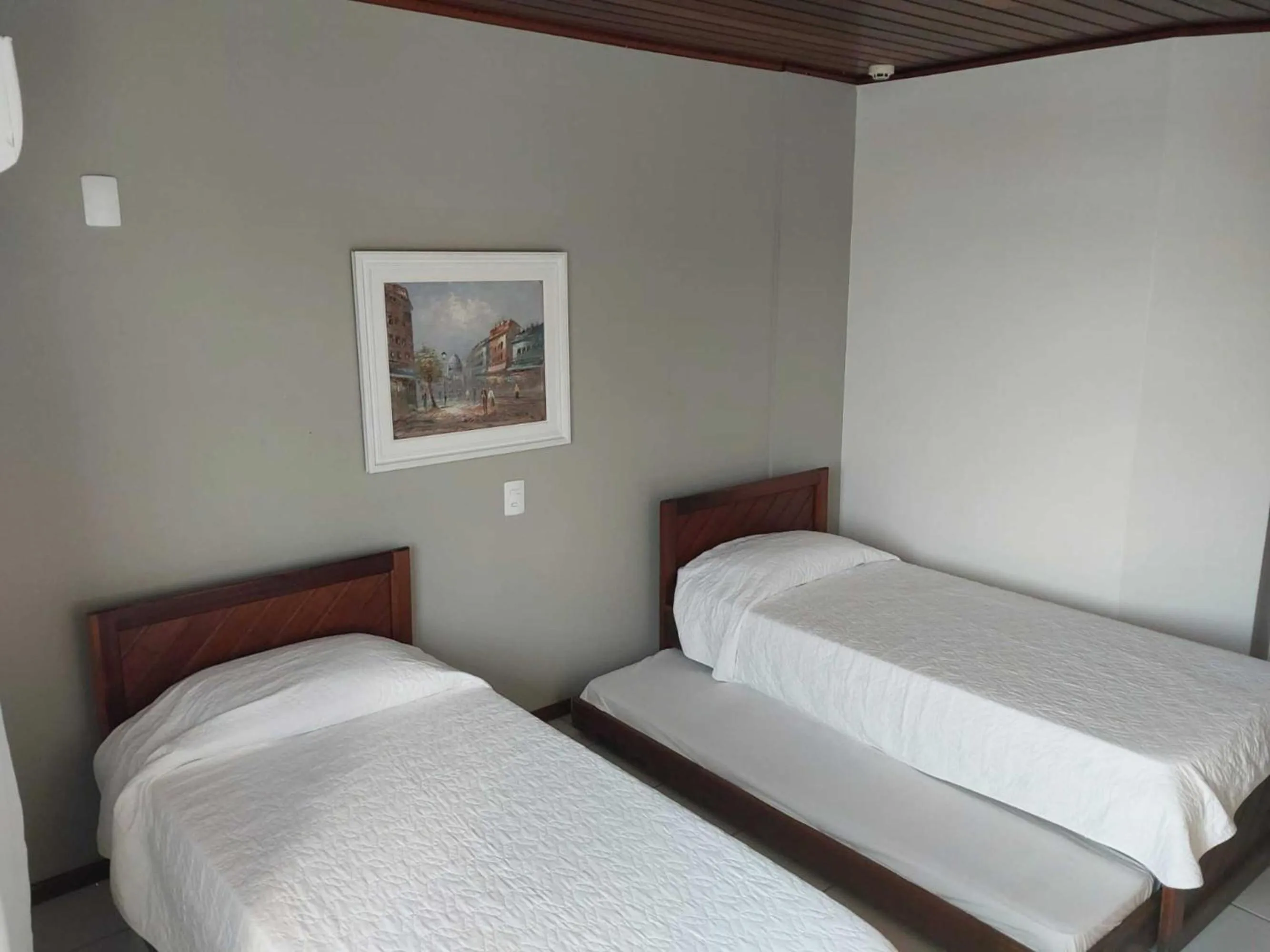 Bed in Flamboyant Hotel