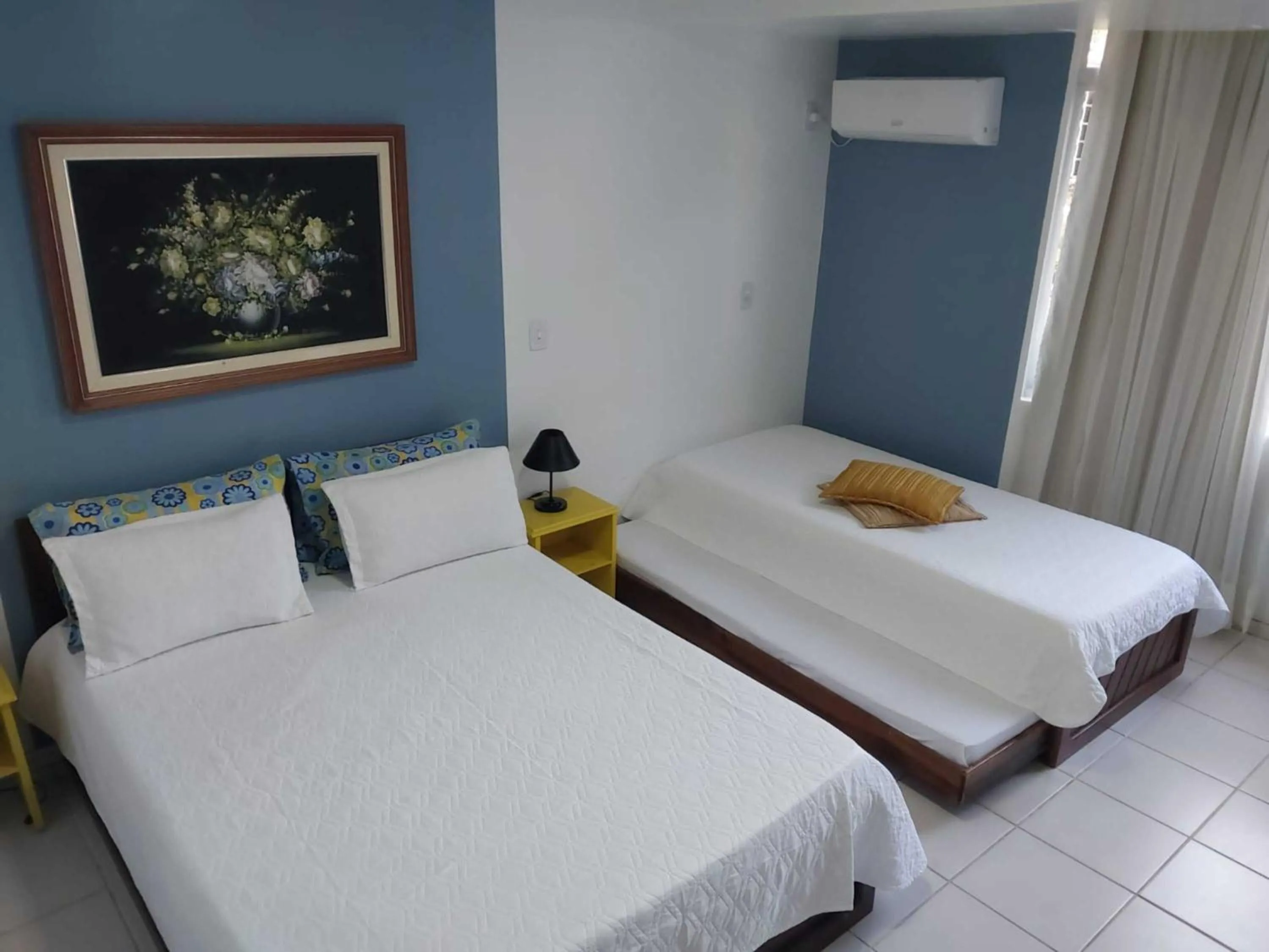 Bed in Flamboyant Hotel