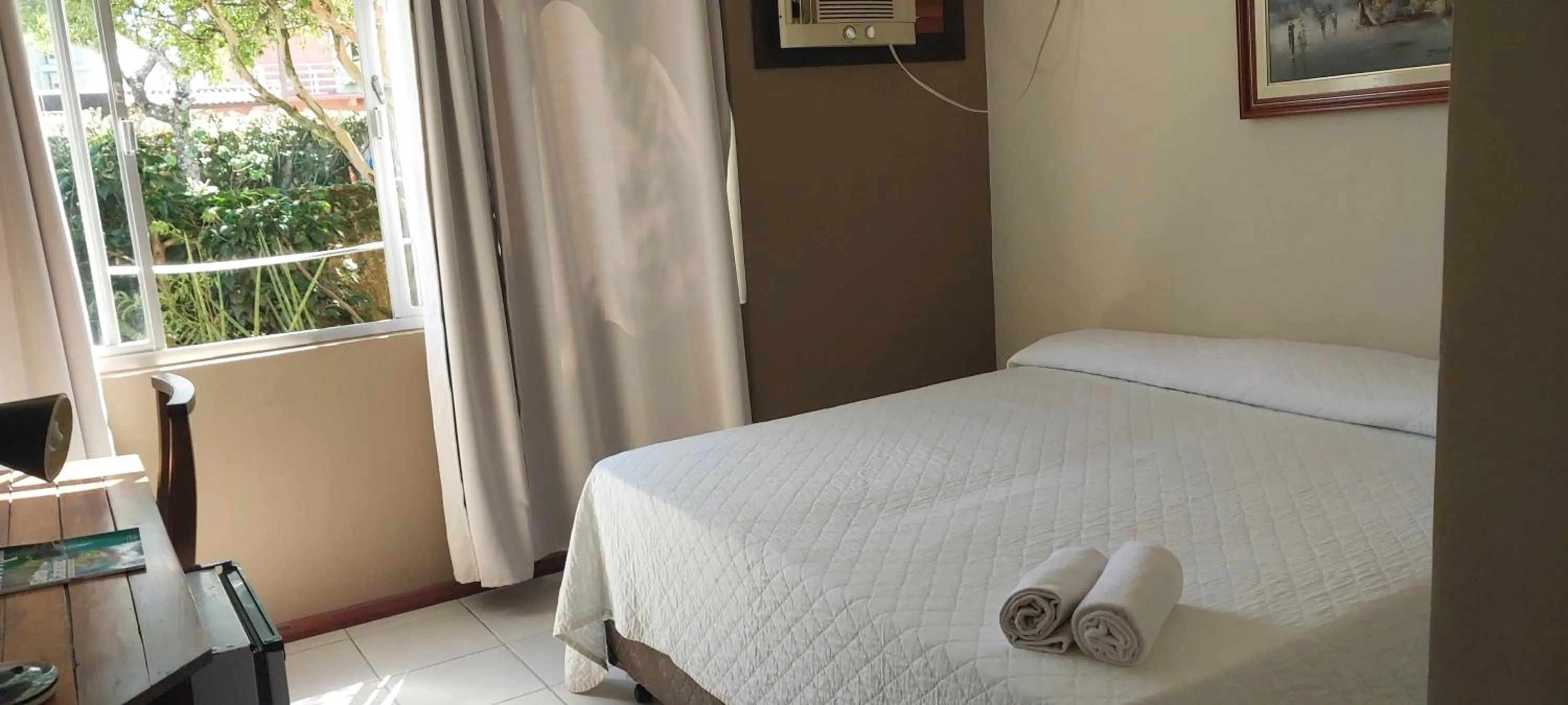 Bed in Flamboyant Hotel