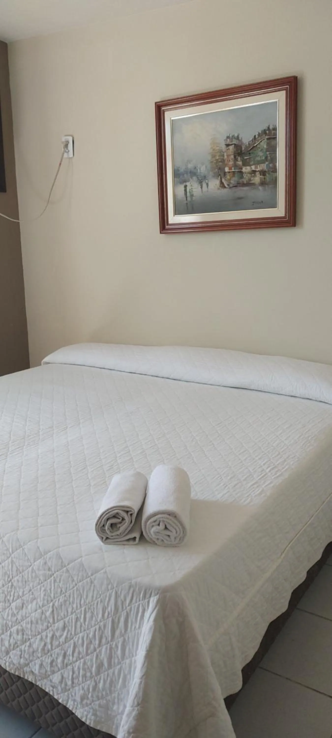 Bed in Flamboyant Hotel