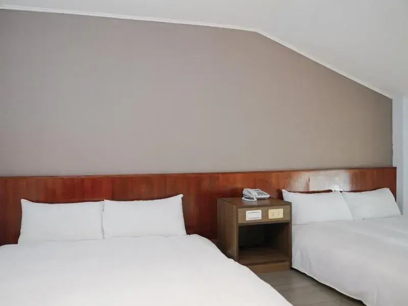 Bed in Dan Lee Inn Bed in Dan Lee Inn