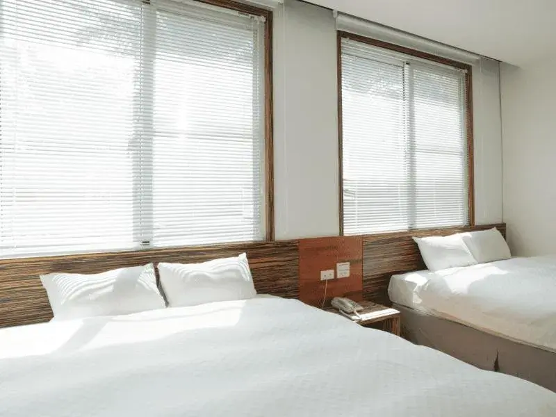 Bed in Dan Lee Inn Bed in Dan Lee Inn