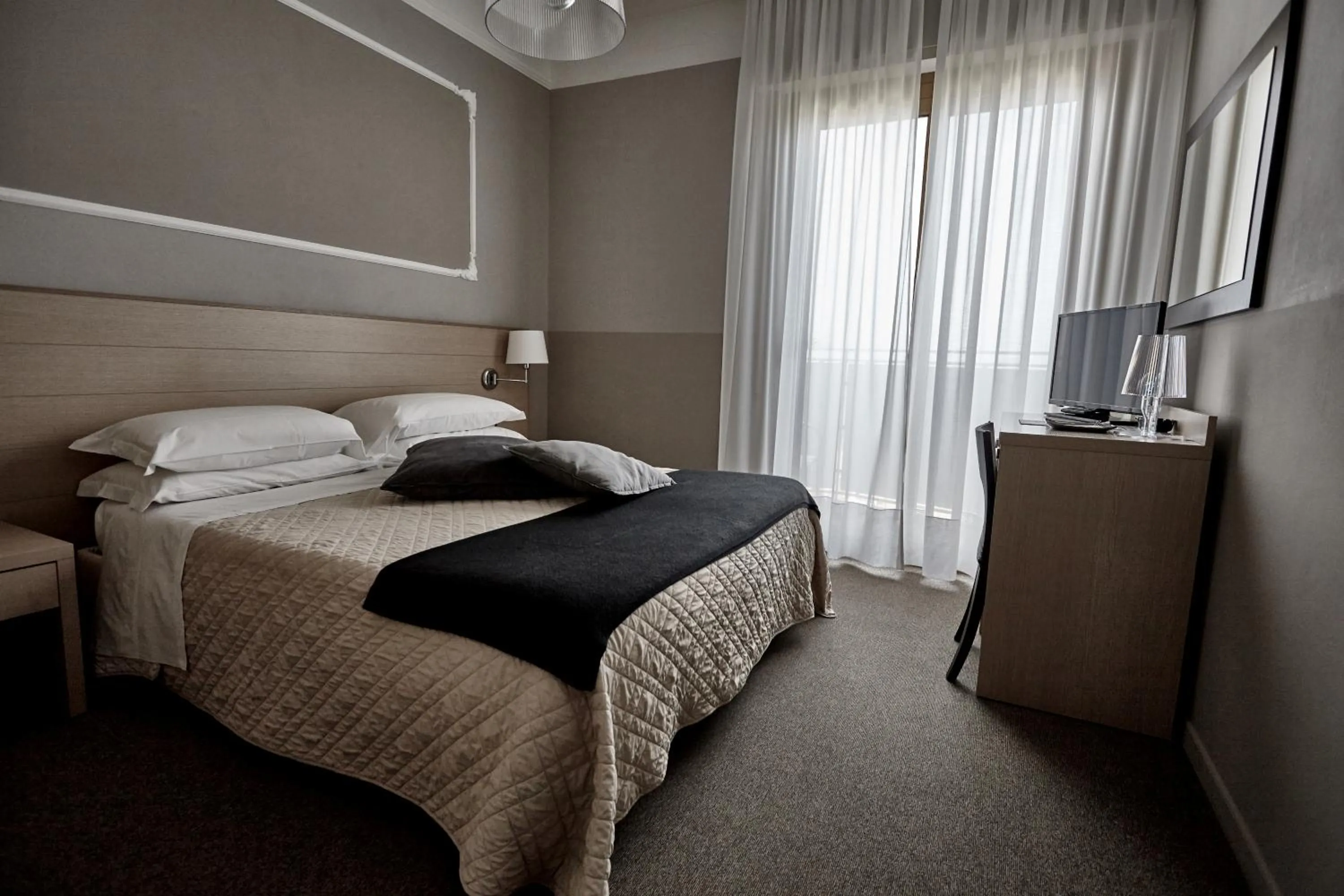 Bed in Rouge Hotel International