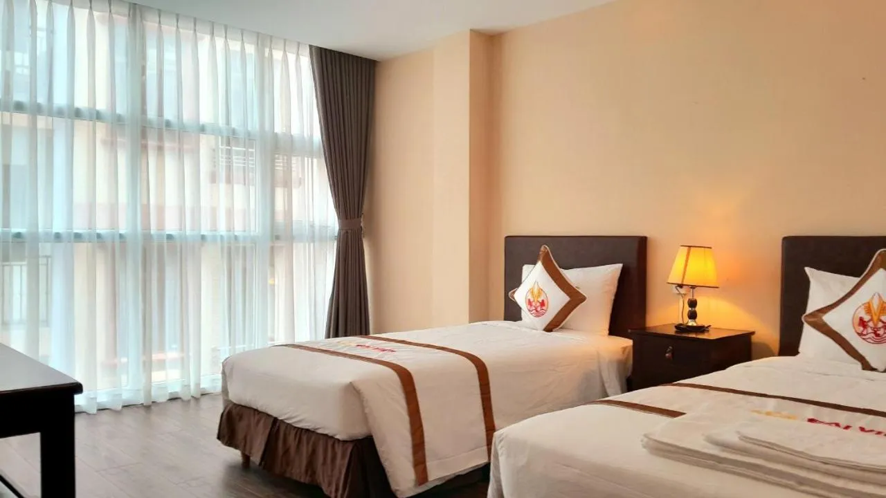 Bed in THE RICE HOTEL