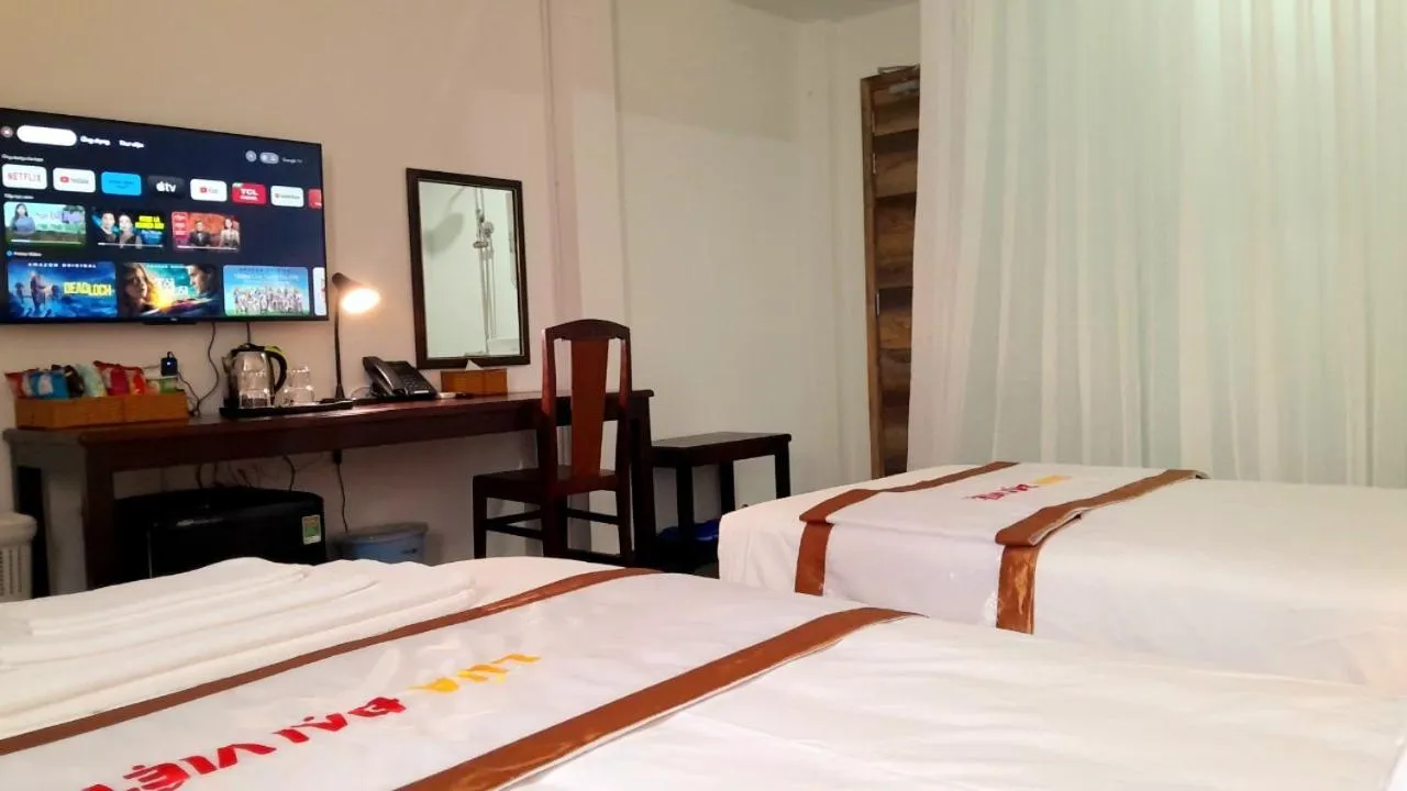 Bed in THE RICE HOTEL