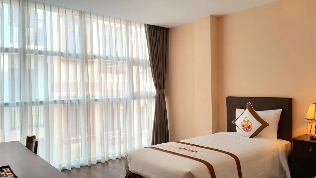 Bed in THE RICE HOTEL