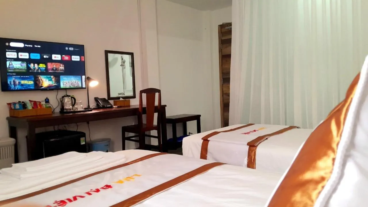 Bed in THE RICE HOTEL