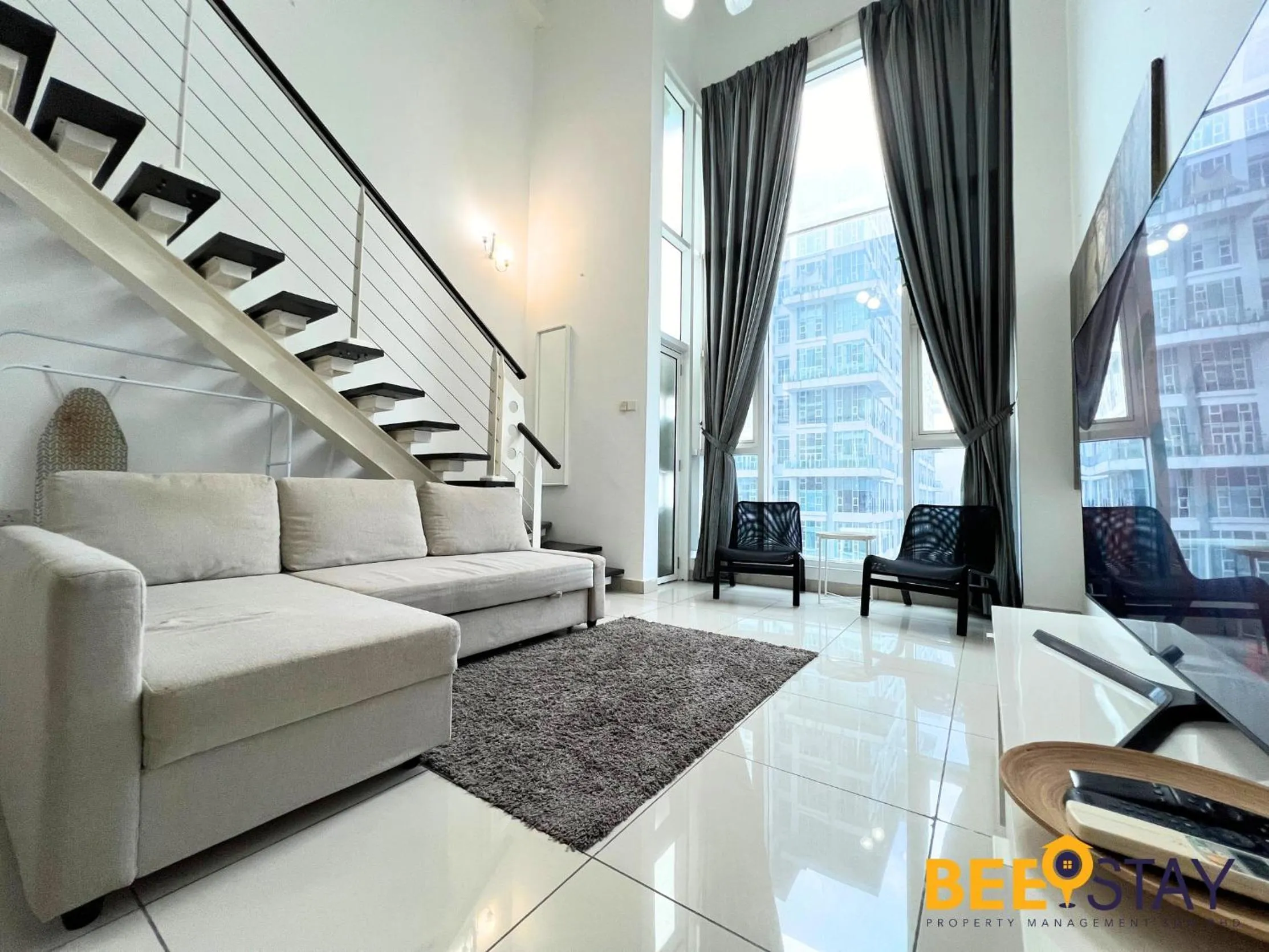 Living room in The Scott Garden Kuala Lumpur by BeeStay Management