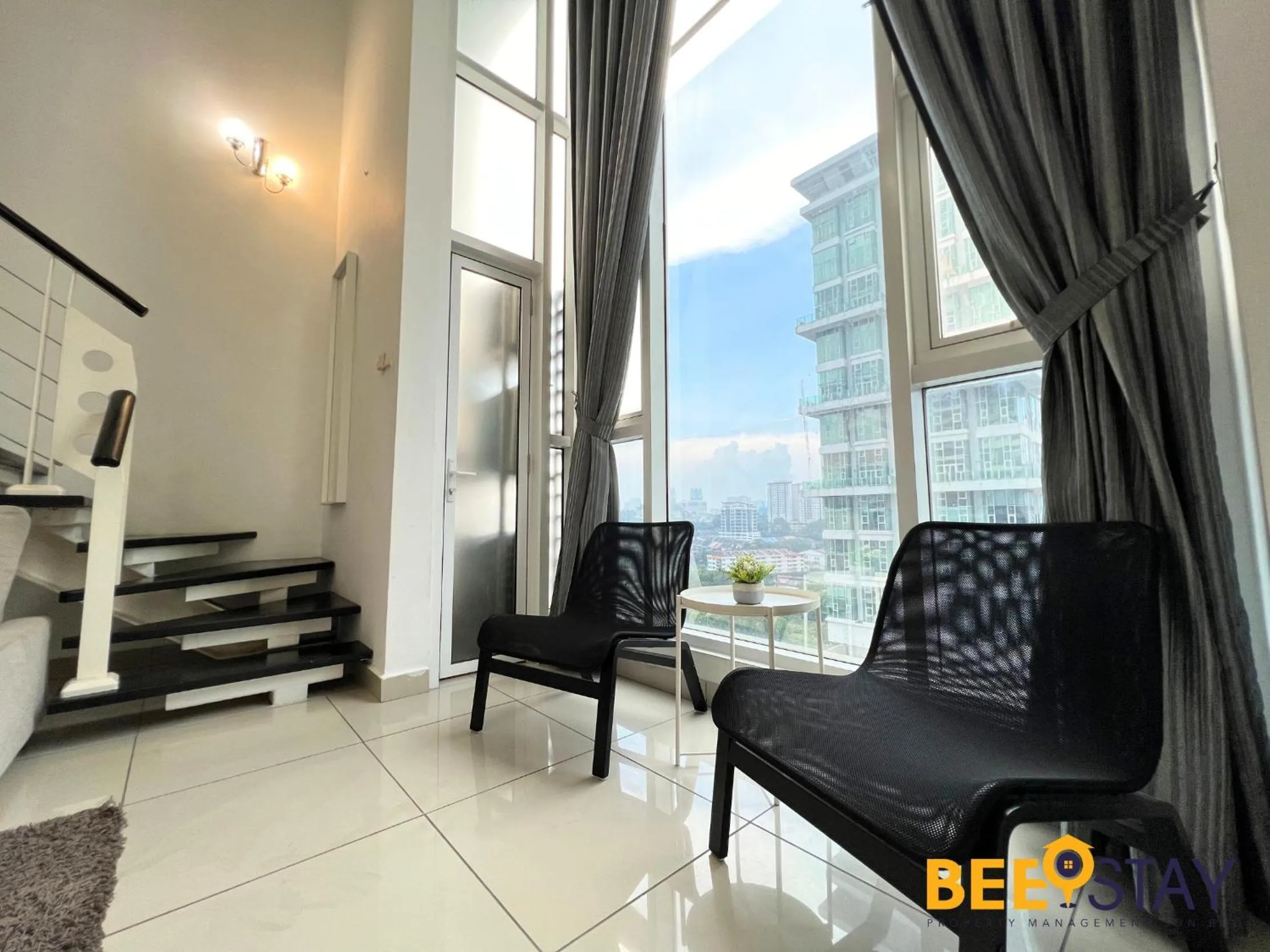 Seating area in The Scott Garden Kuala Lumpur by BeeStay Management