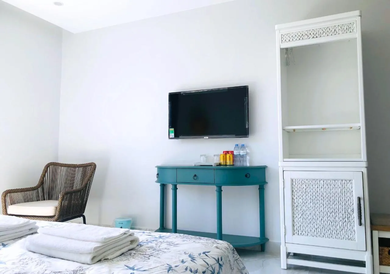 Communal lounge/ TV room, Bed in Moonlight Hotel Phu Quoc