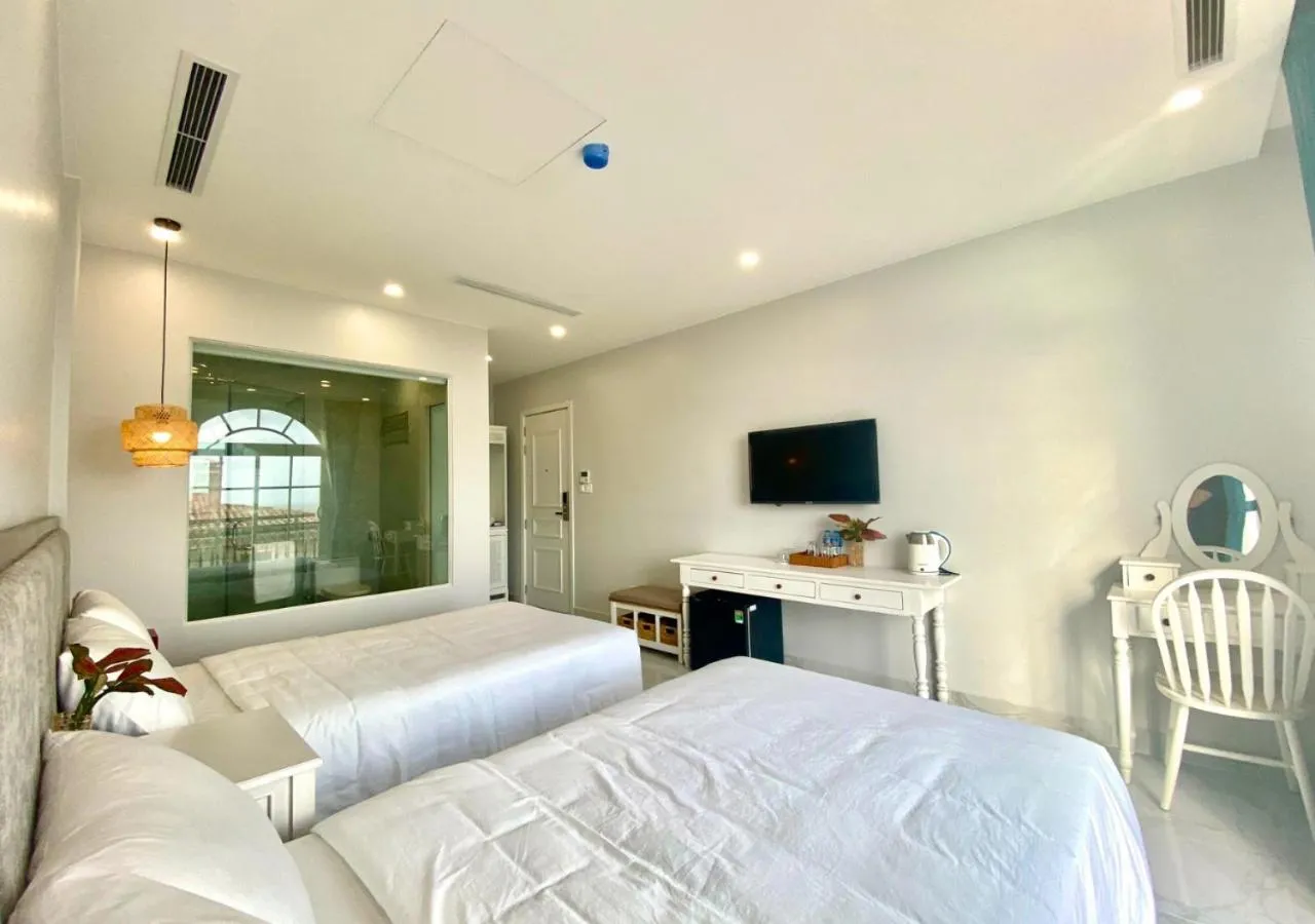 Communal lounge/ TV room, Bed in Moonlight Hotel Phu Quoc