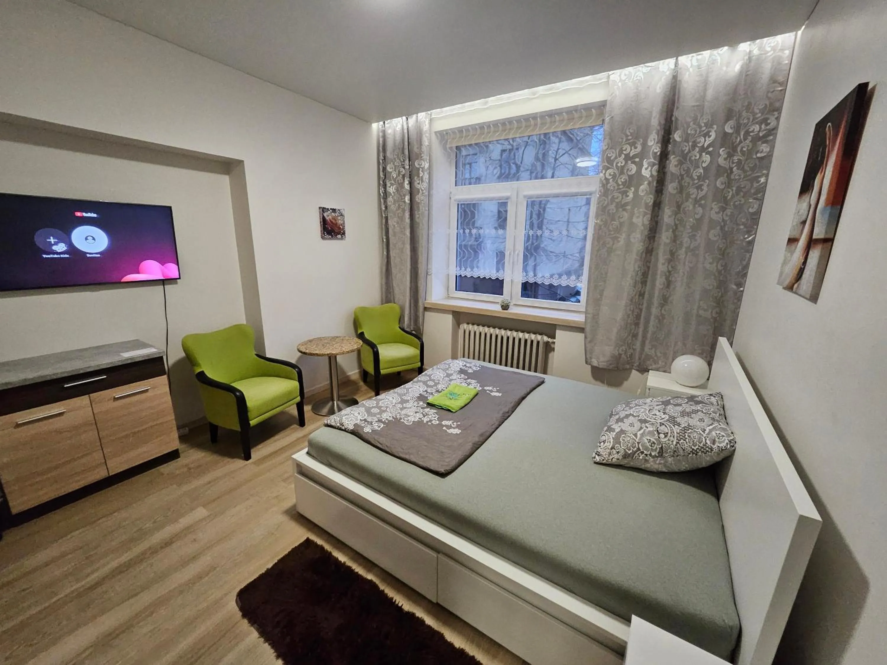 Bed in Kauno apartamentai king size bed