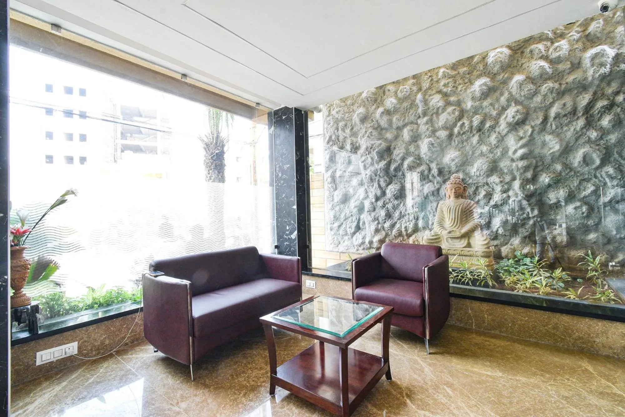 Seating area in FabHotel Prime Prowell Apex