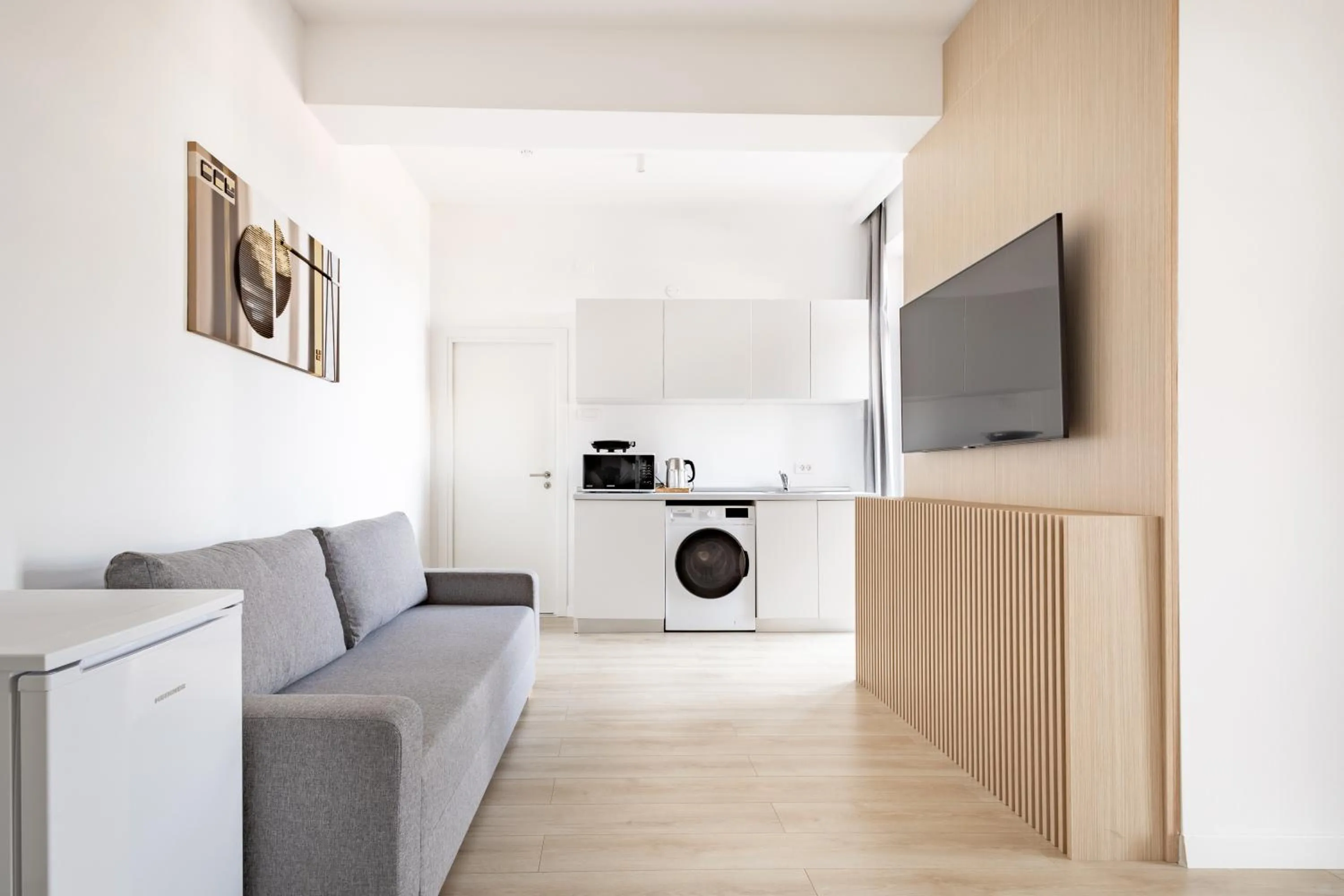 Communal lounge/ TV room in Piccolo Mondo by CityBookings