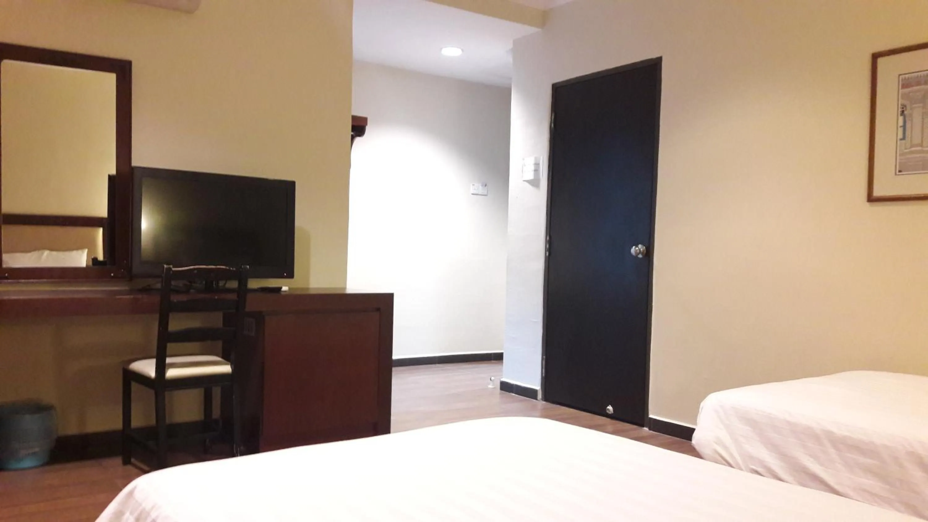 Bed in Cheng Ho Hotel