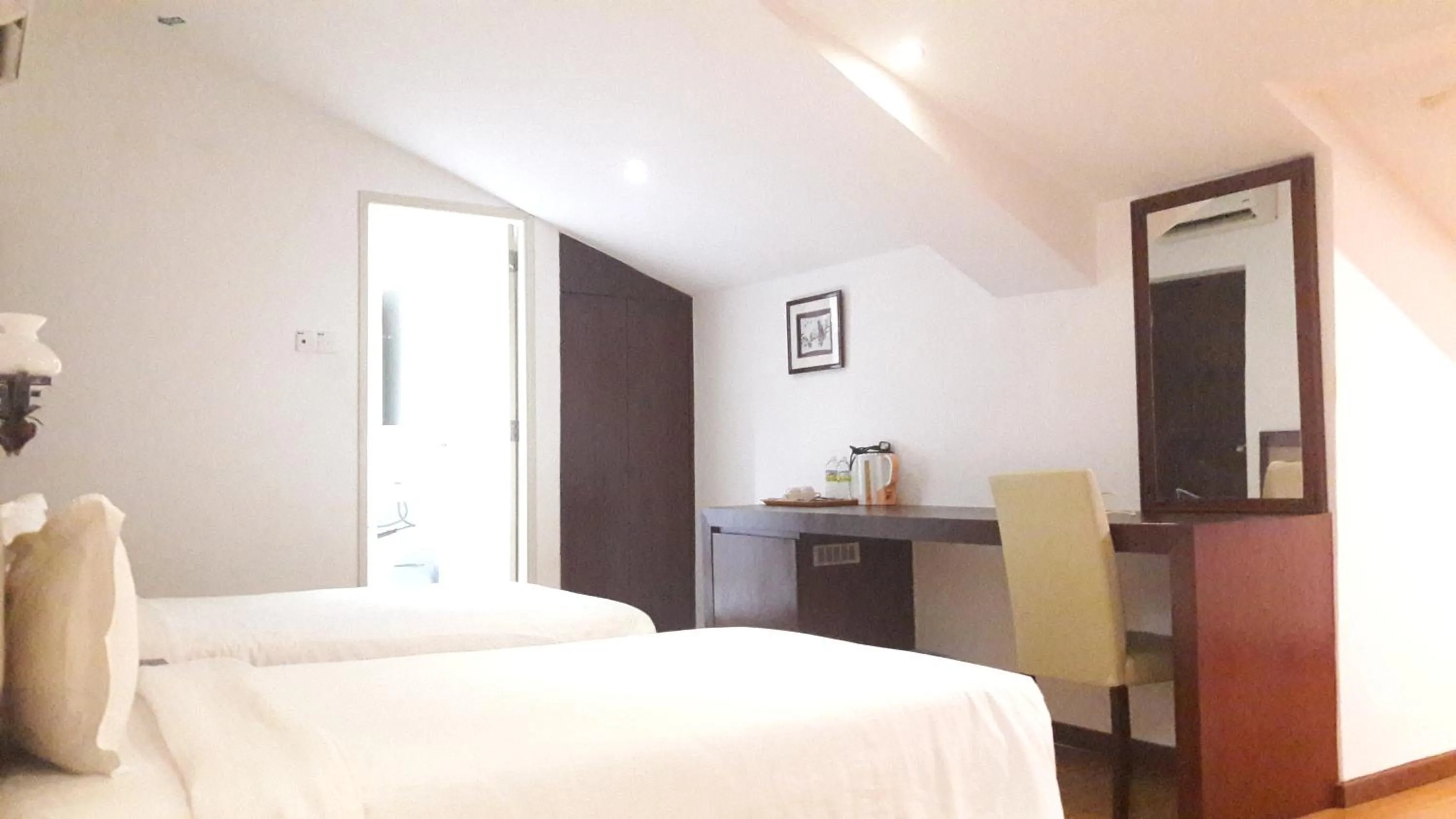 Bed in Cheng Ho Hotel