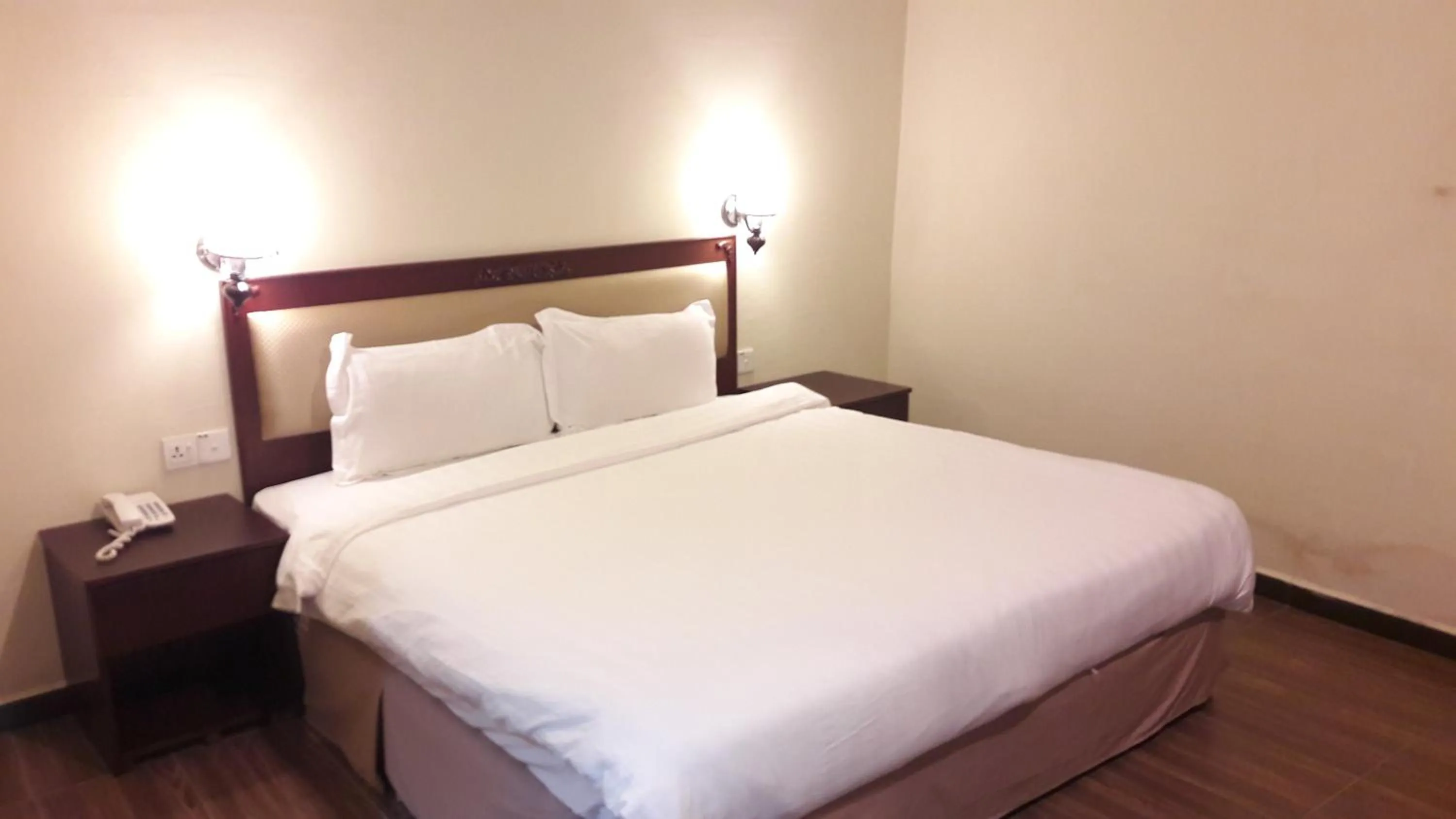 Bed in Cheng Ho Hotel