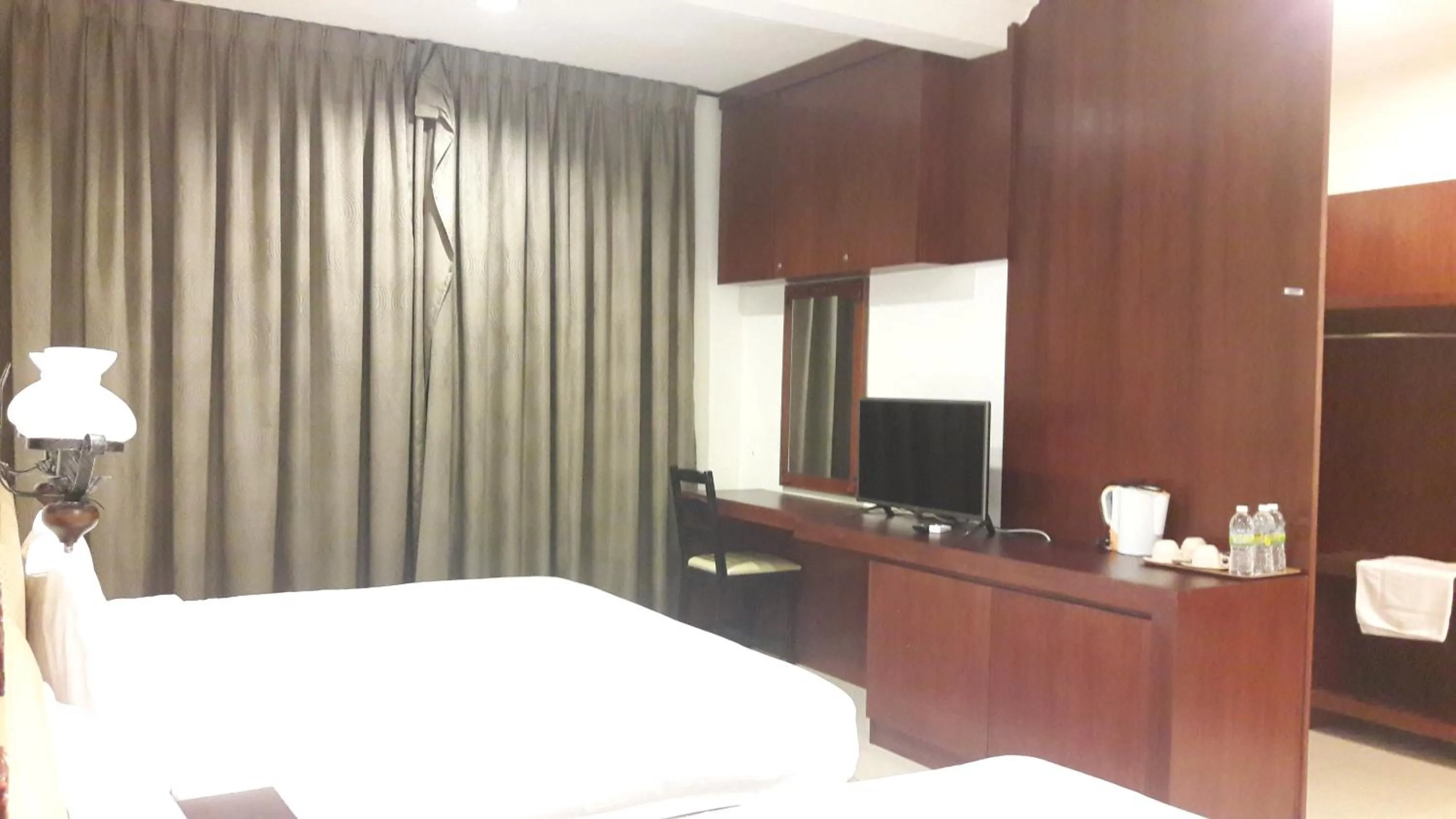 Bed in Cheng Ho Hotel