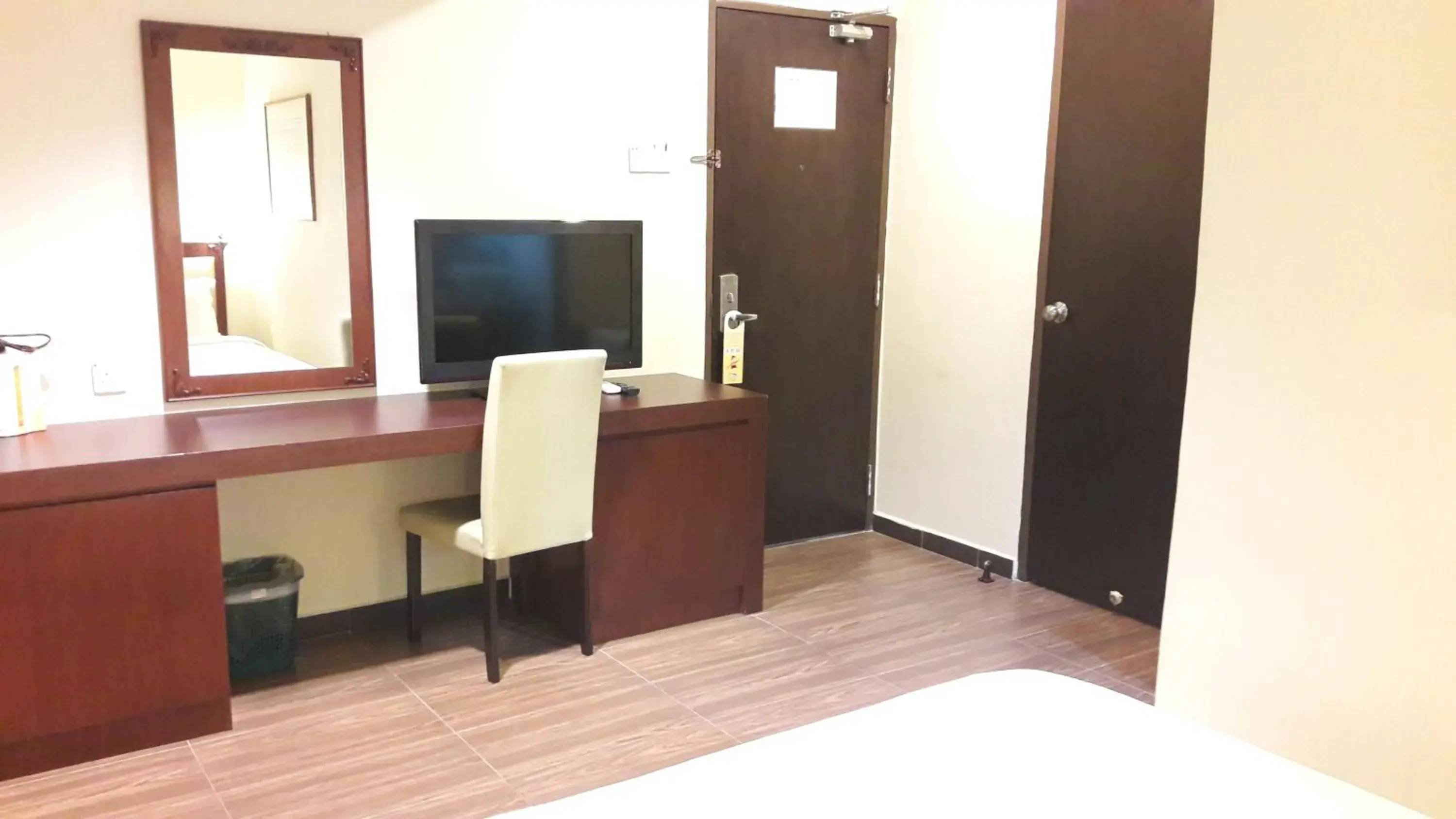 Communal lounge/ TV room, Bed in Cheng Ho Hotel Communal lounge/ TV room, Bed in Cheng Ho Hotel