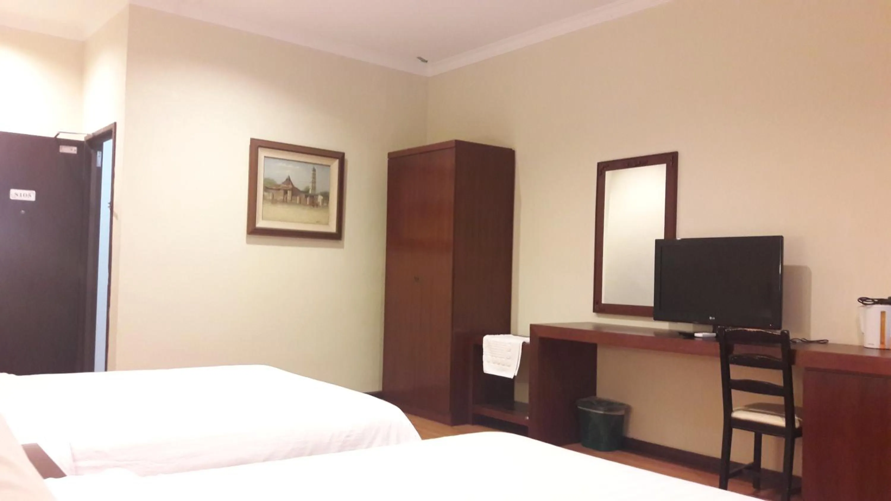 Bed in Cheng Ho Hotel