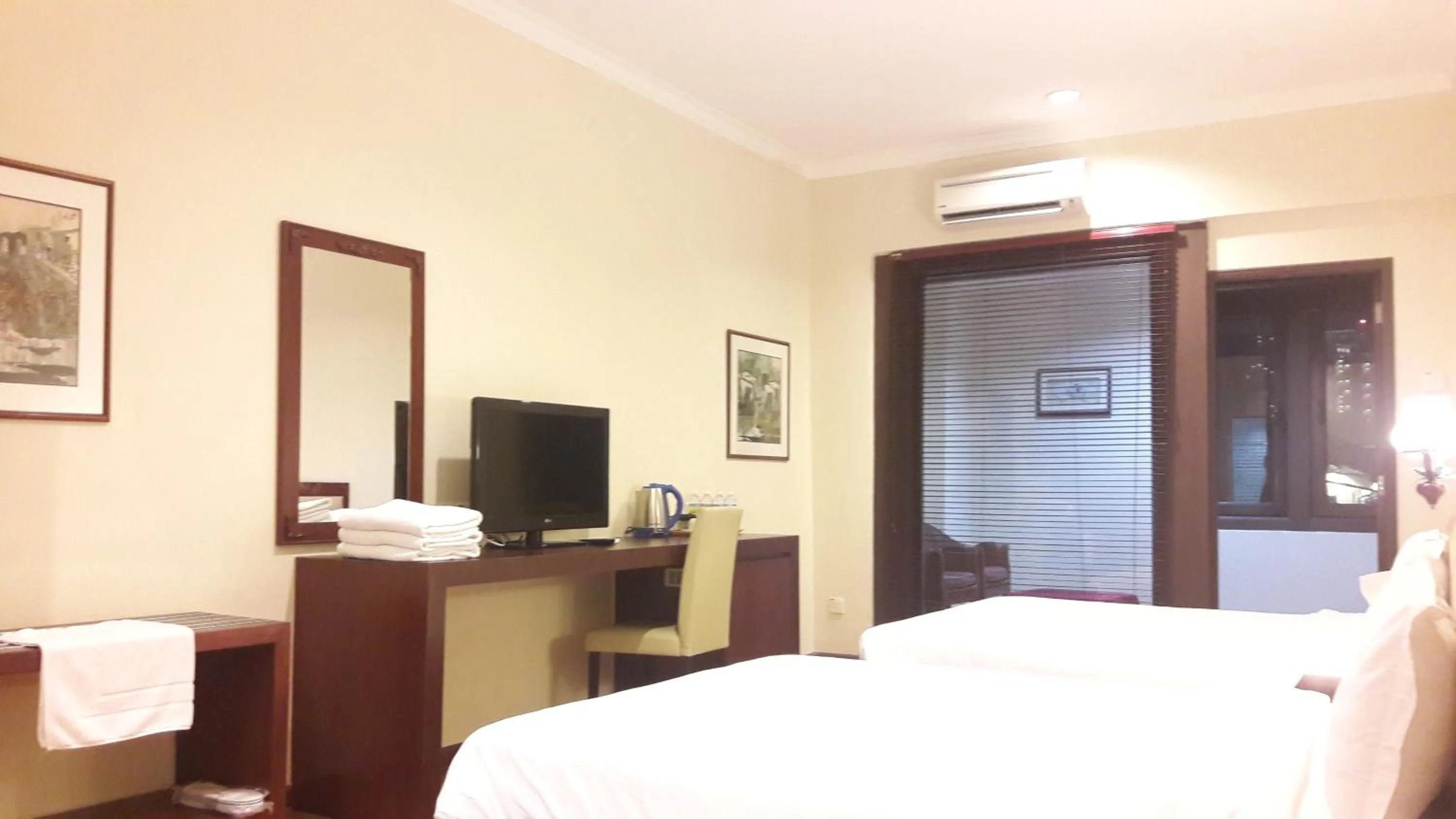 Bed in Cheng Ho Hotel