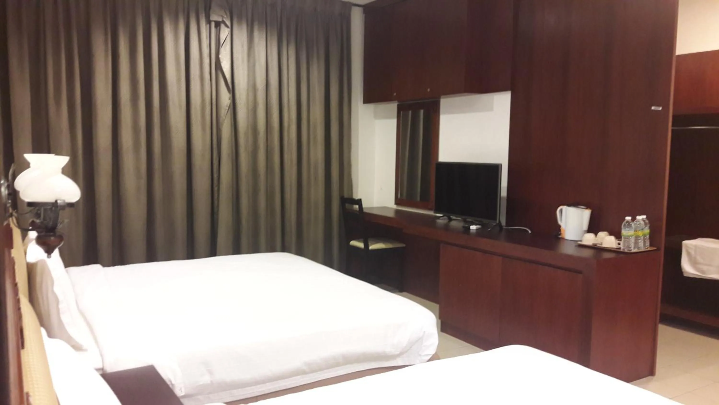 Bed in Cheng Ho Hotel