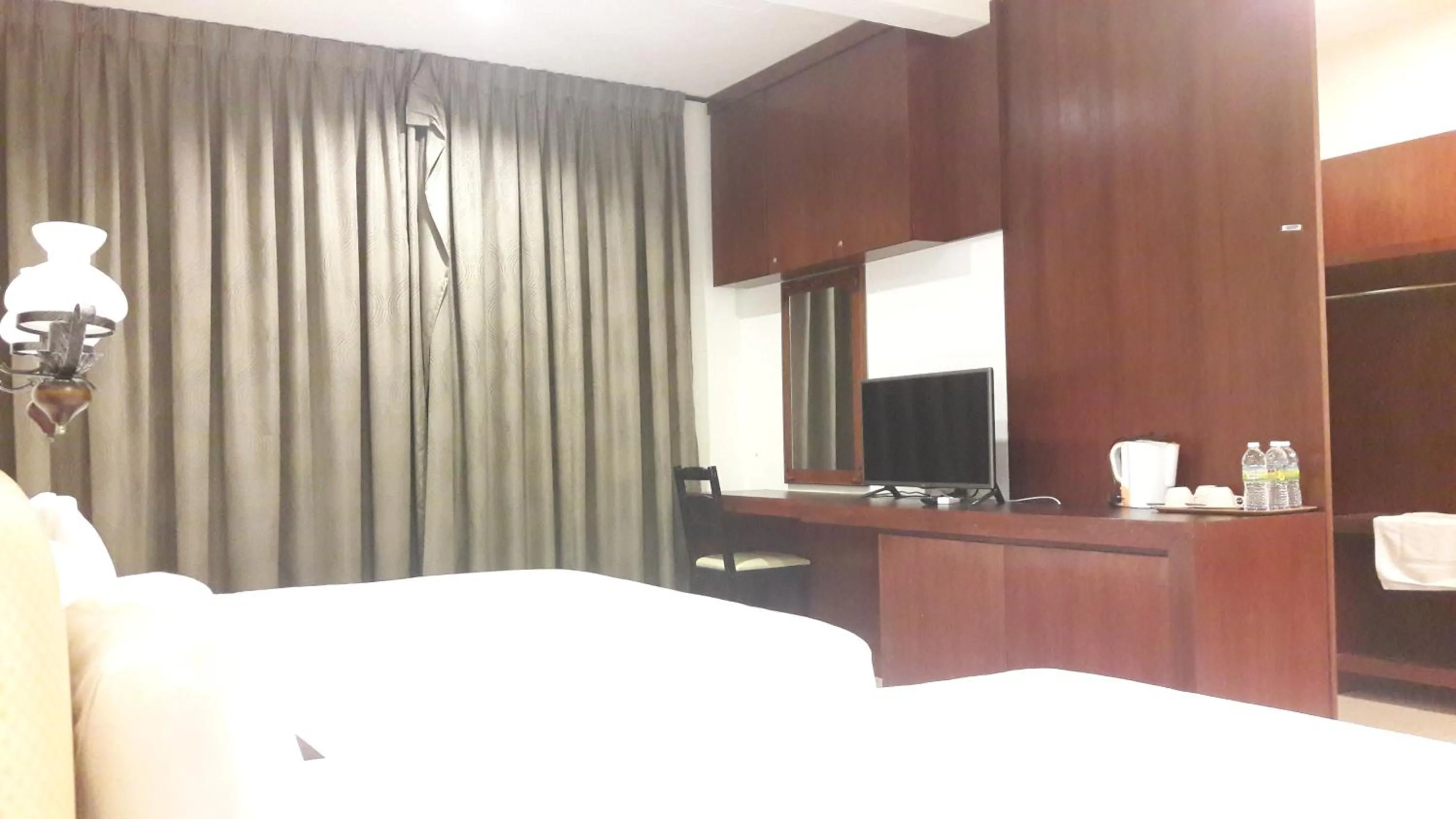 Bed in Cheng Ho Hotel