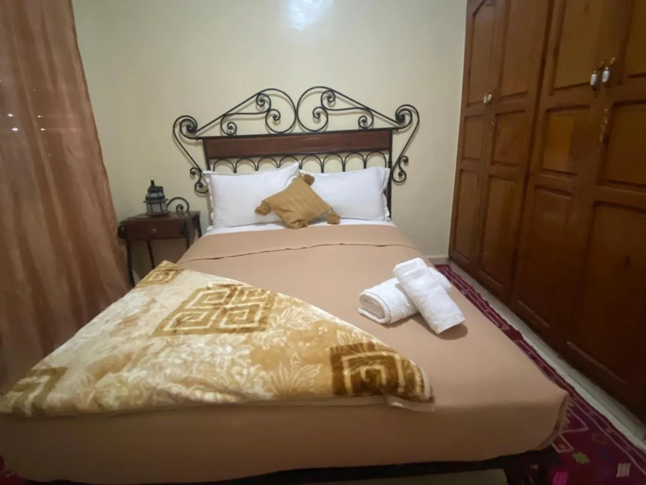 Bed in APPART AIGLE HOTEL