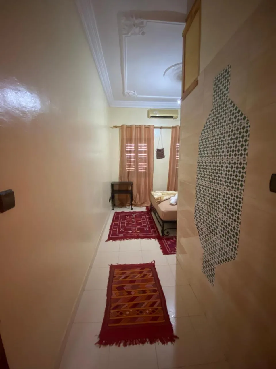 Bed in APPART AIGLE HOTEL