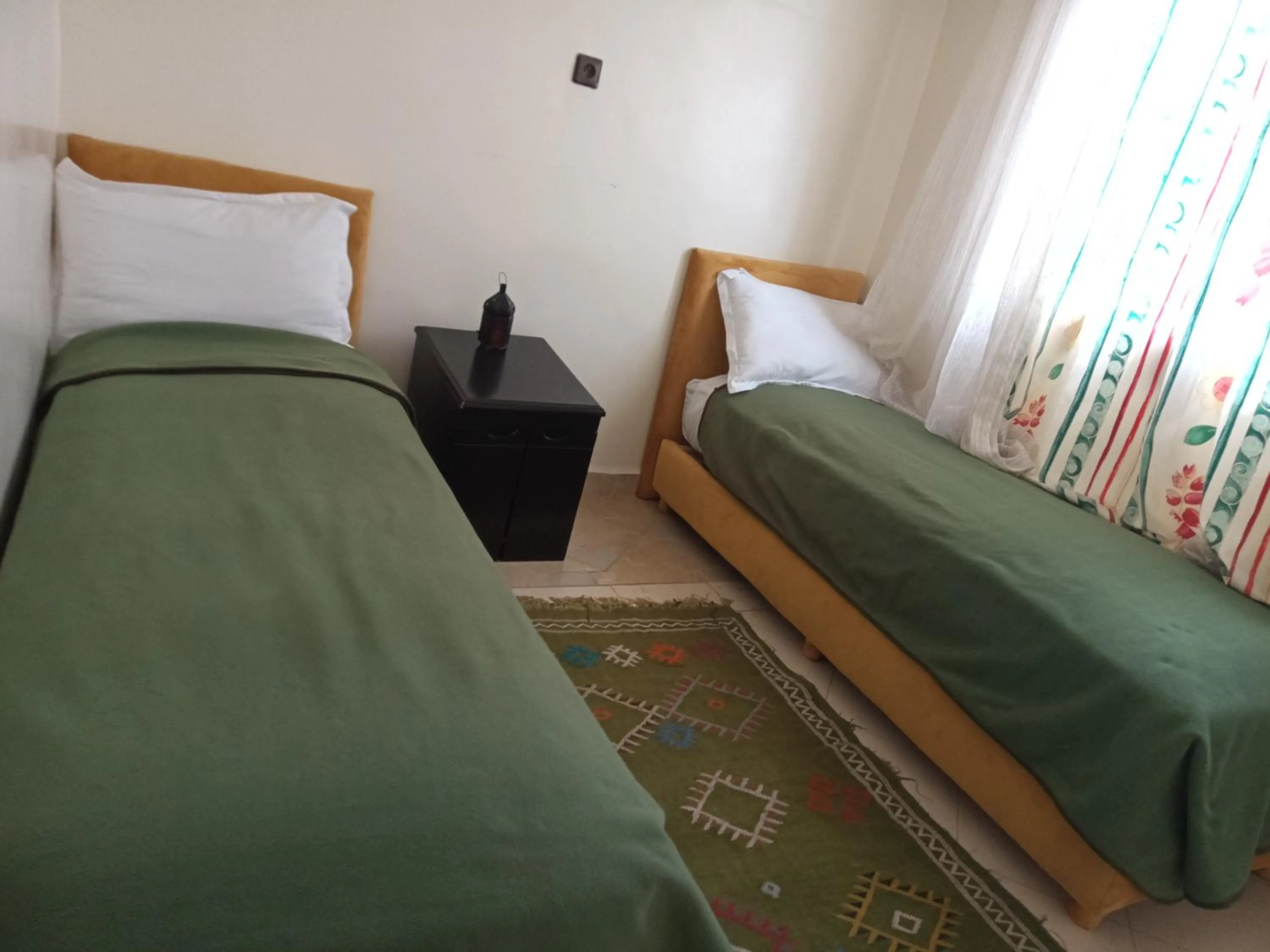 Bed in APPART AIGLE HOTEL