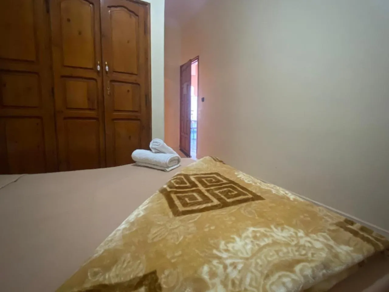 Bed in APPART AIGLE HOTEL