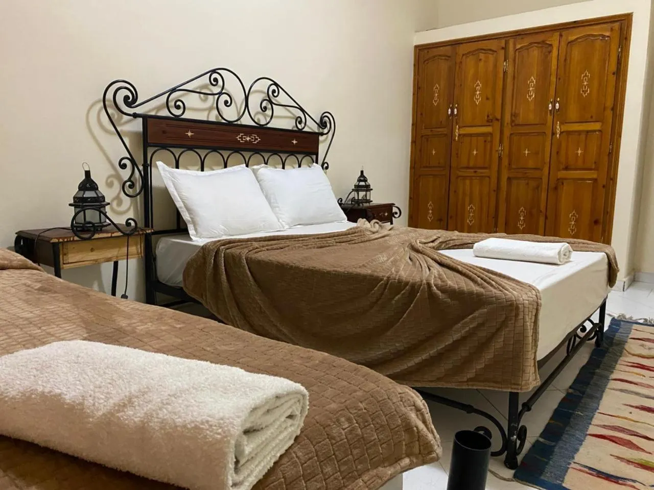 Bed in APPART AIGLE HOTEL