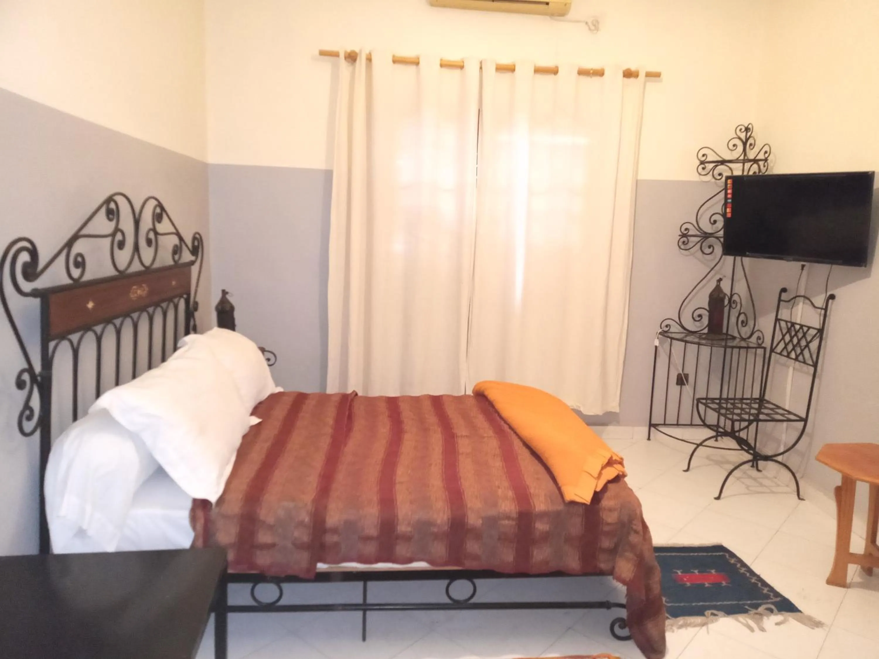 Bed in APPART AIGLE HOTEL