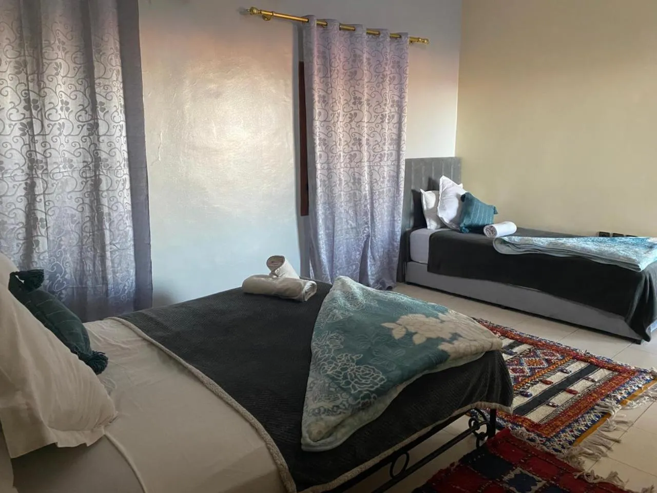 Bed in APPART AIGLE HOTEL