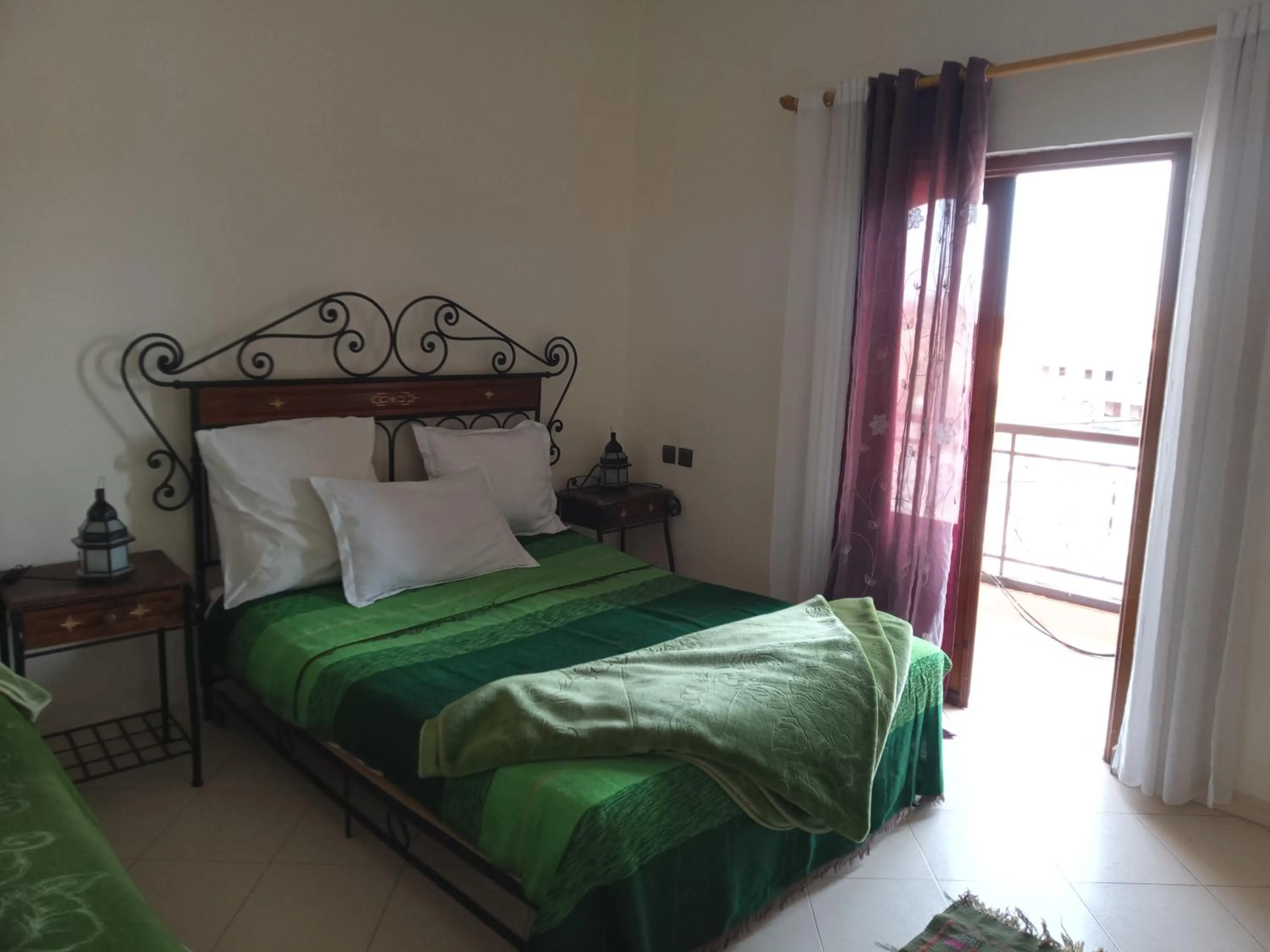 Bed in APPART AIGLE HOTEL