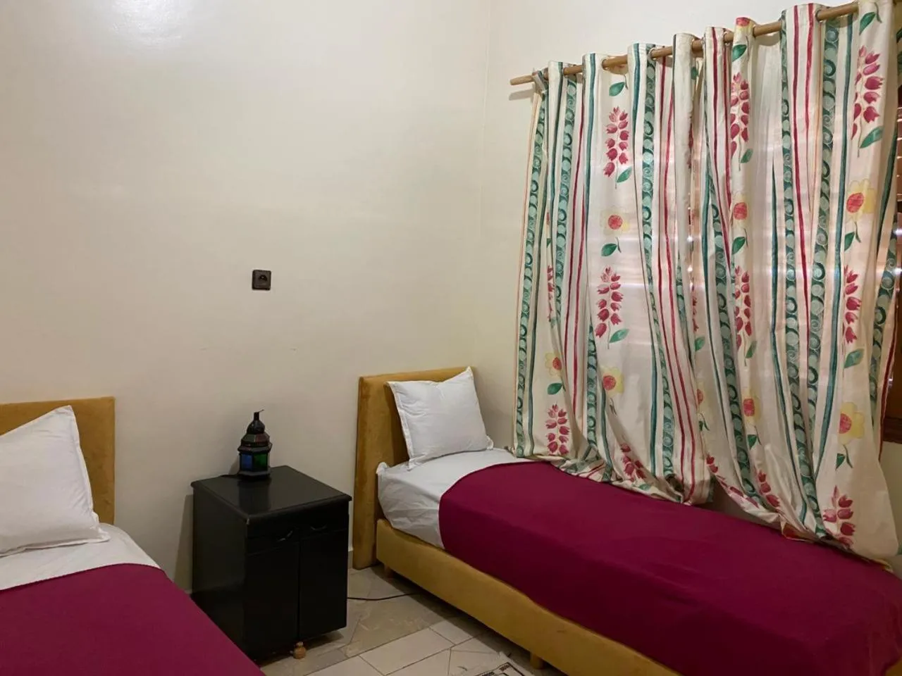 Bed in APPART AIGLE HOTEL